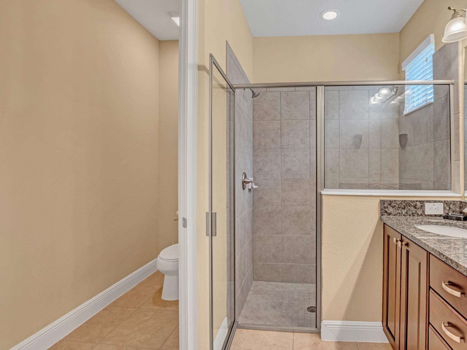 Tiled Shower Area of the Home in Kissimmee Florida - Sleek design and modern amenities offer a soothing escape - Refresh, renew, and indulge in the comfort of your personal oasis