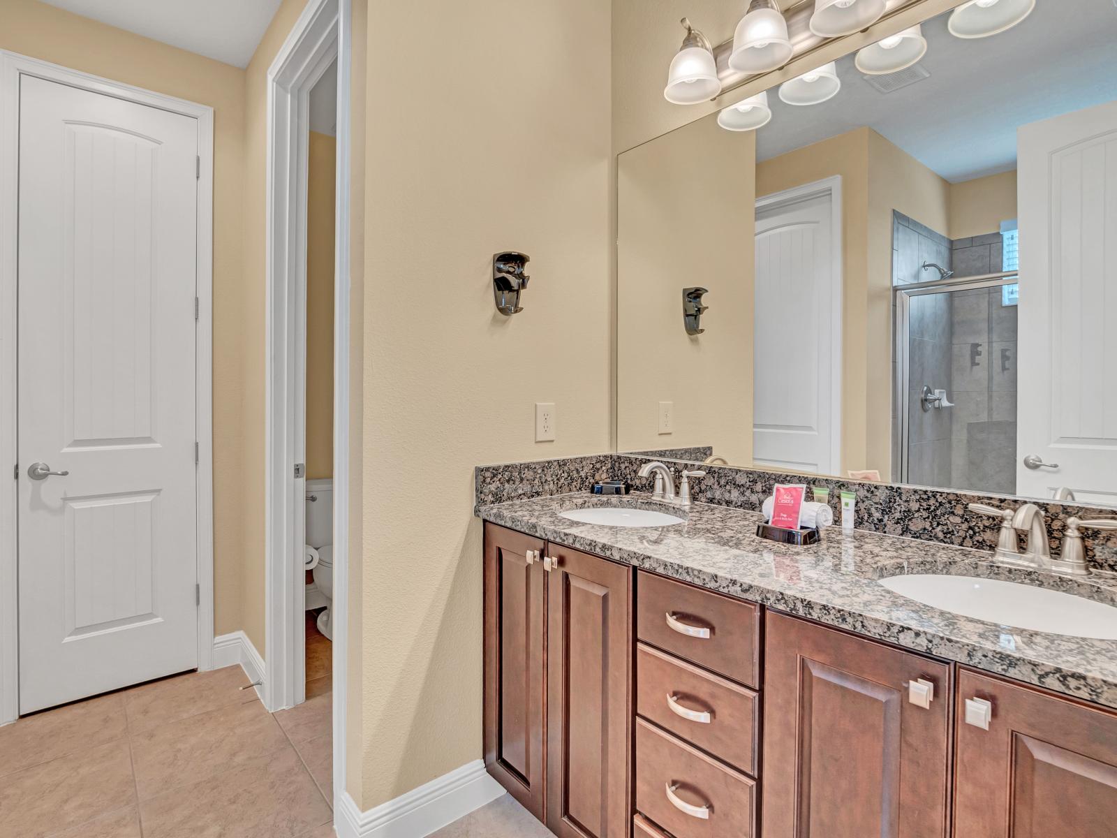 Lavish Bathroom of the Home in Kissimmee Florida - Every detail is meticulously designed for both style and functionality - Unwind in the evening amidst the luxury - Chic Dual Vanity