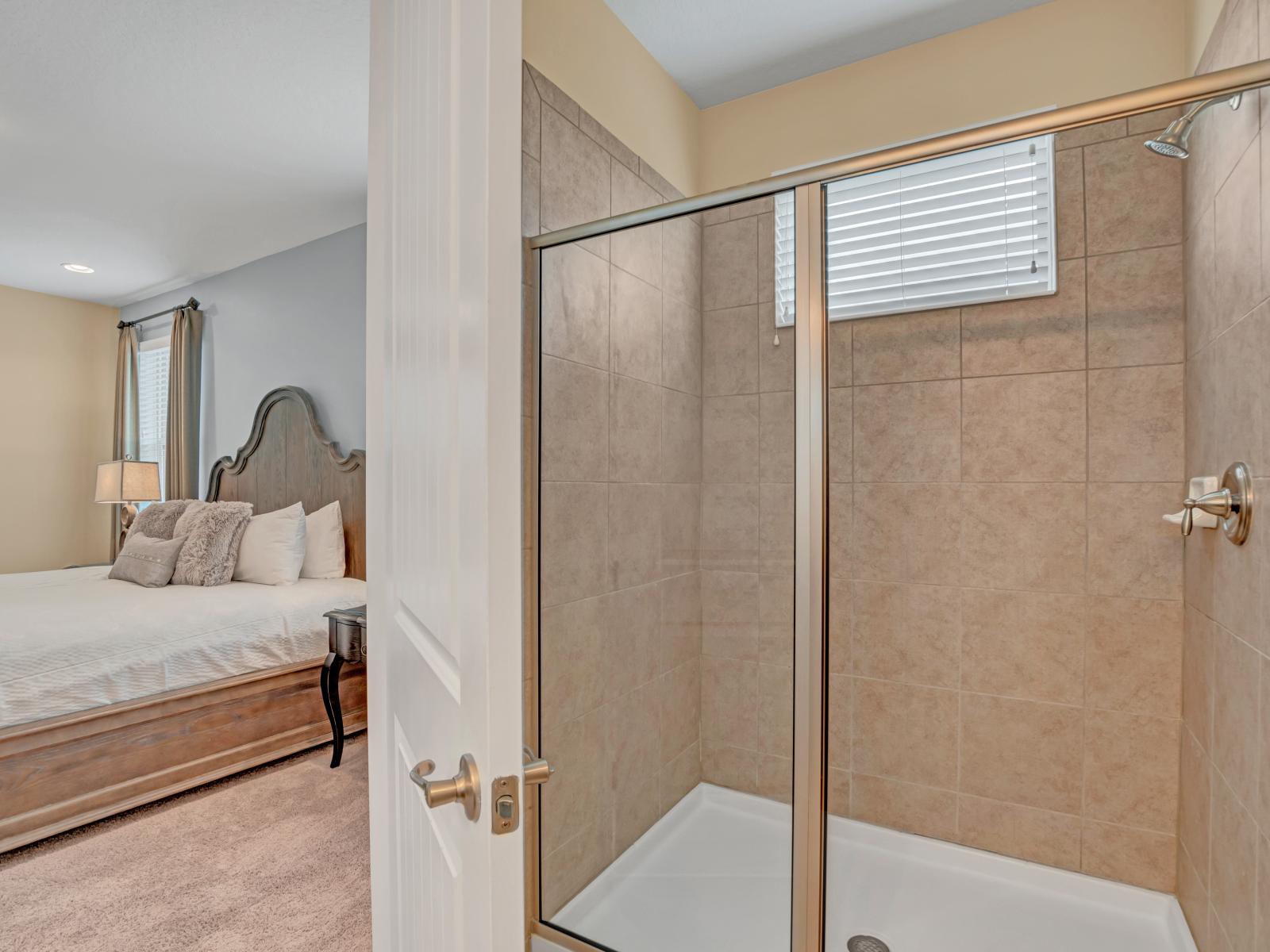 Stylish Bathroom of the Home in Kissimmee Florida - Bathing in relaxing embrace - Bathroom adorned walk-in shower area - Elegant bathroom with luxurious fixtures and finishes