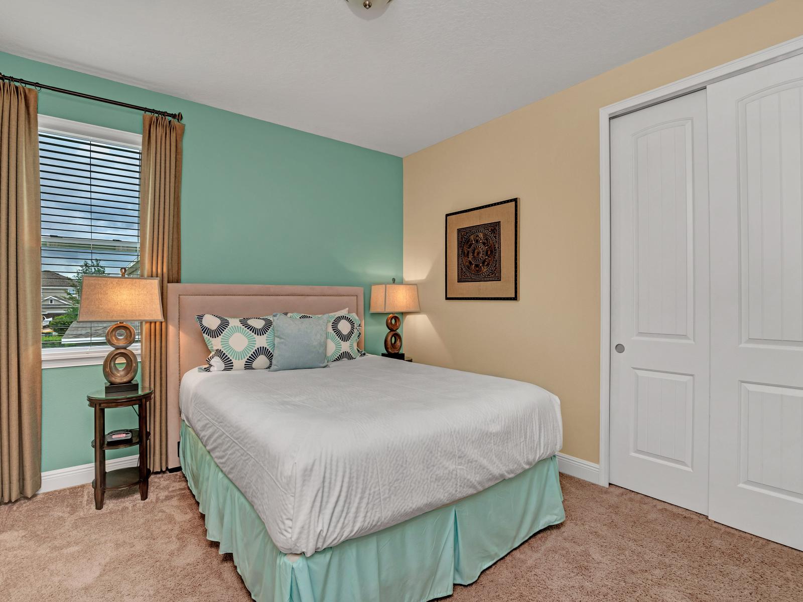 Eclat Bedroom of the Home in Kissimmee Florida - Bedroom with green accent wall - Comfy double bed - Cozy retreat with a plush bed, perfect for relaxation