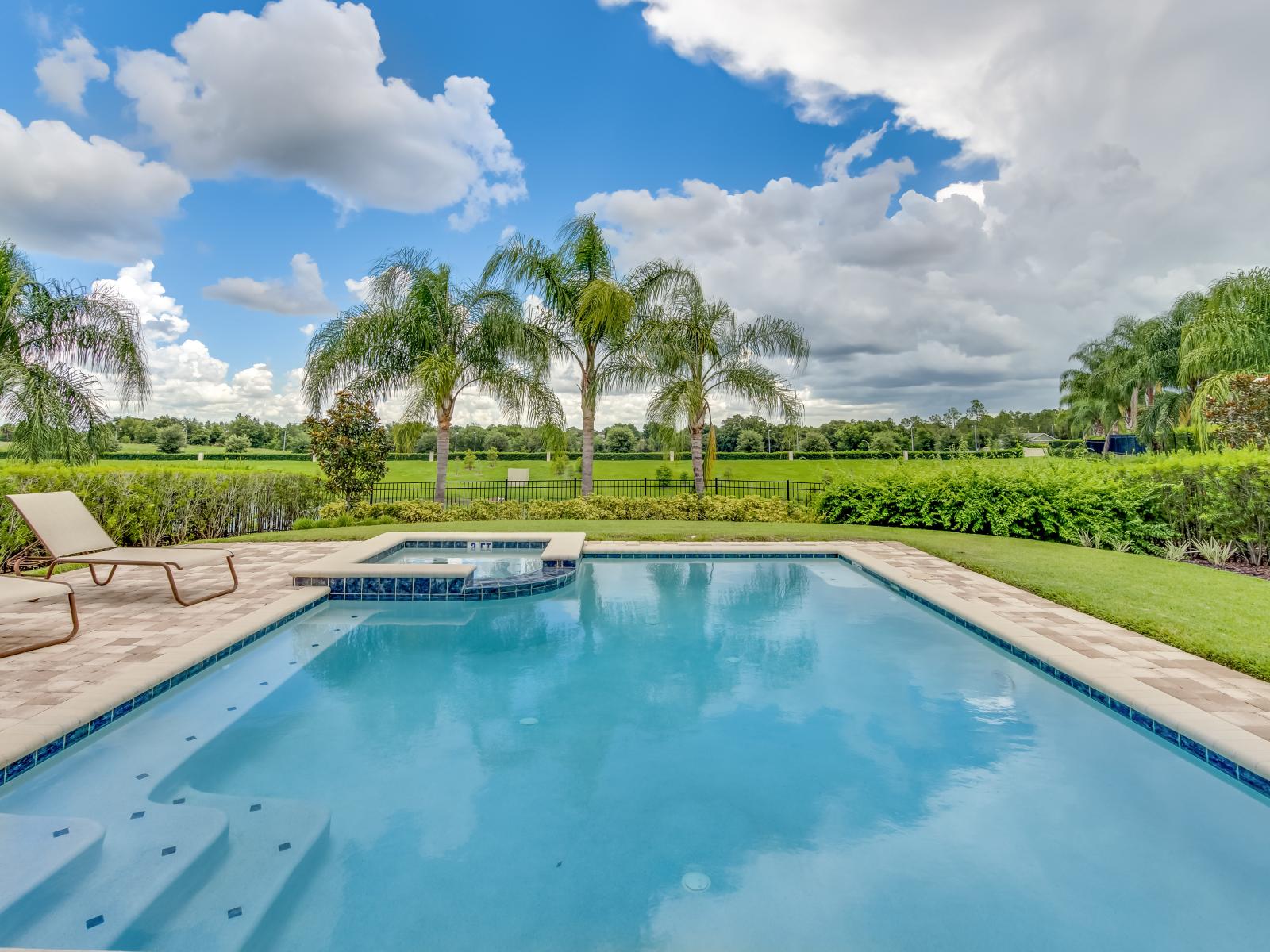 Splendid Outdoor pool Area of the Home in Kissimmee Florida - Dive into relaxation at the outdoor pool area  - Sparkling waters and sun-kissed loungers create an oasis of leisure and rejuvenation - Embrace the tranquility of the outdoors