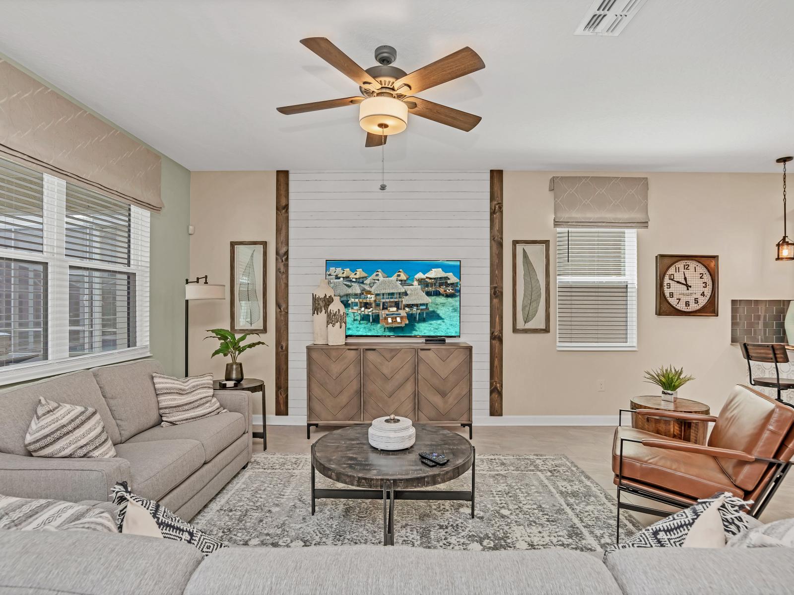 Lavish Living Area of the Home in Reunion Florida - The modern design of the living area exudes sleek sophistication  - Smart TV and Netflix - It offers a stylish and inviting space to relax and unwind in style