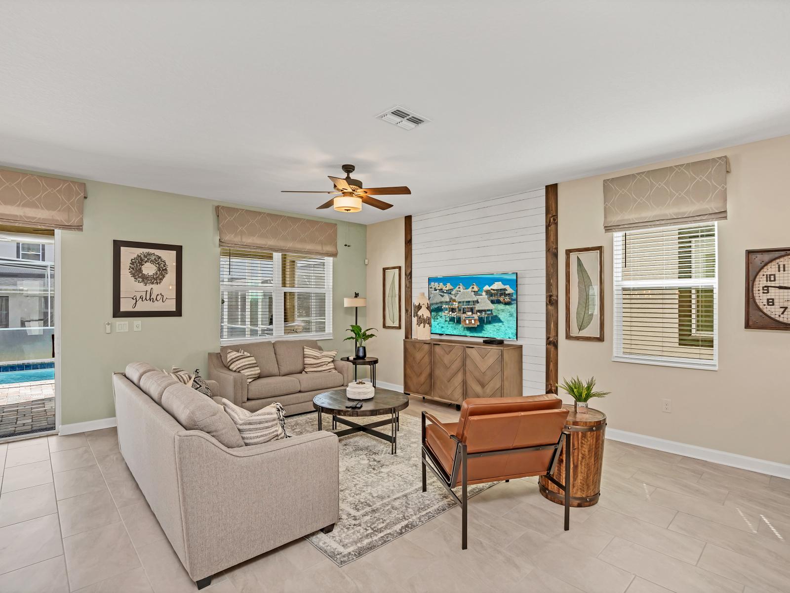 Inviting living area of the Home in Reunion Florida - Comfy seating arrangements - Well-chosen lighting fixtures adding both functionality and charm - Smart TV and Netflix