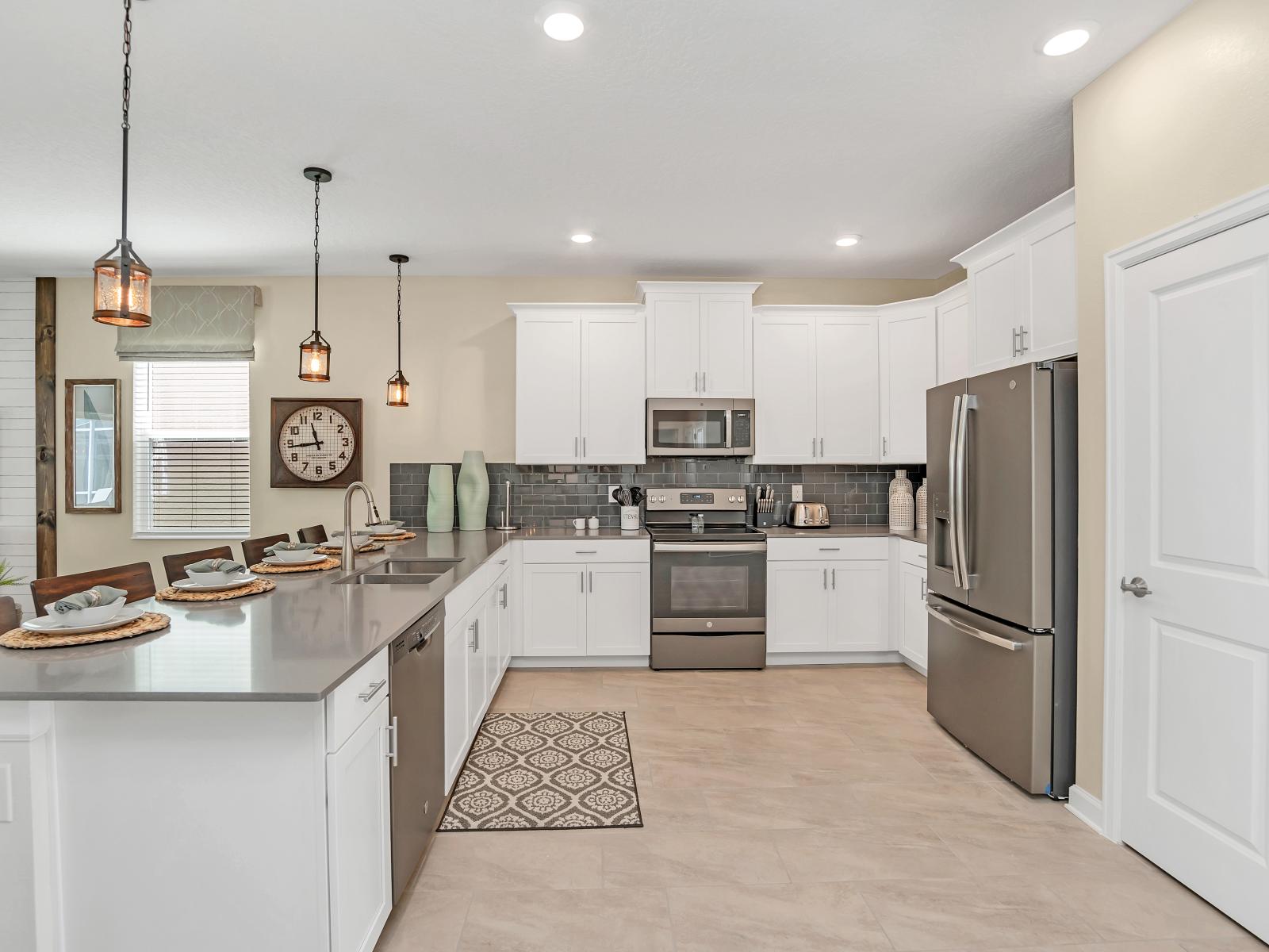 Regal Kitchen  of the Home in Reunion Florida - Discover the joy of cooking in our fully equipped kitchen - A sleek and stylish space designed for both utility and aesthetics - Plenty of Storage Options