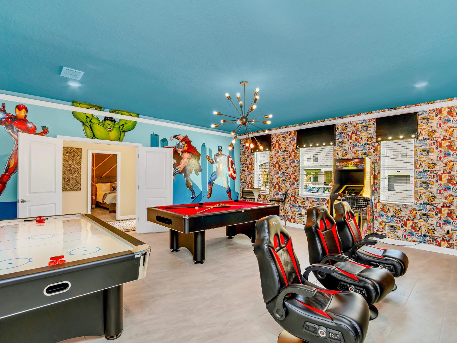 Game Room of the Home in Reunion Florida - From heroic decor to exciting game options - A space where everyone can unleash their inner superheroes  - Create lasting memories