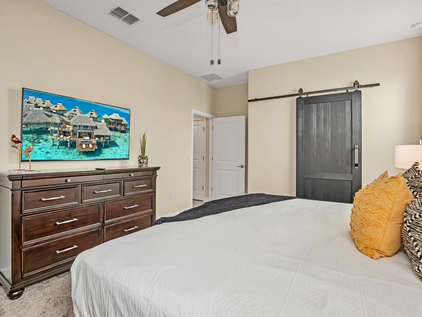 Eclat Bedroom of the Home in Reunion Florida - Pristine surroundings, cozy bed, and refreshing ambiance - It's a peaceful sanctuary to unwind and enjoy a restful night's sleep