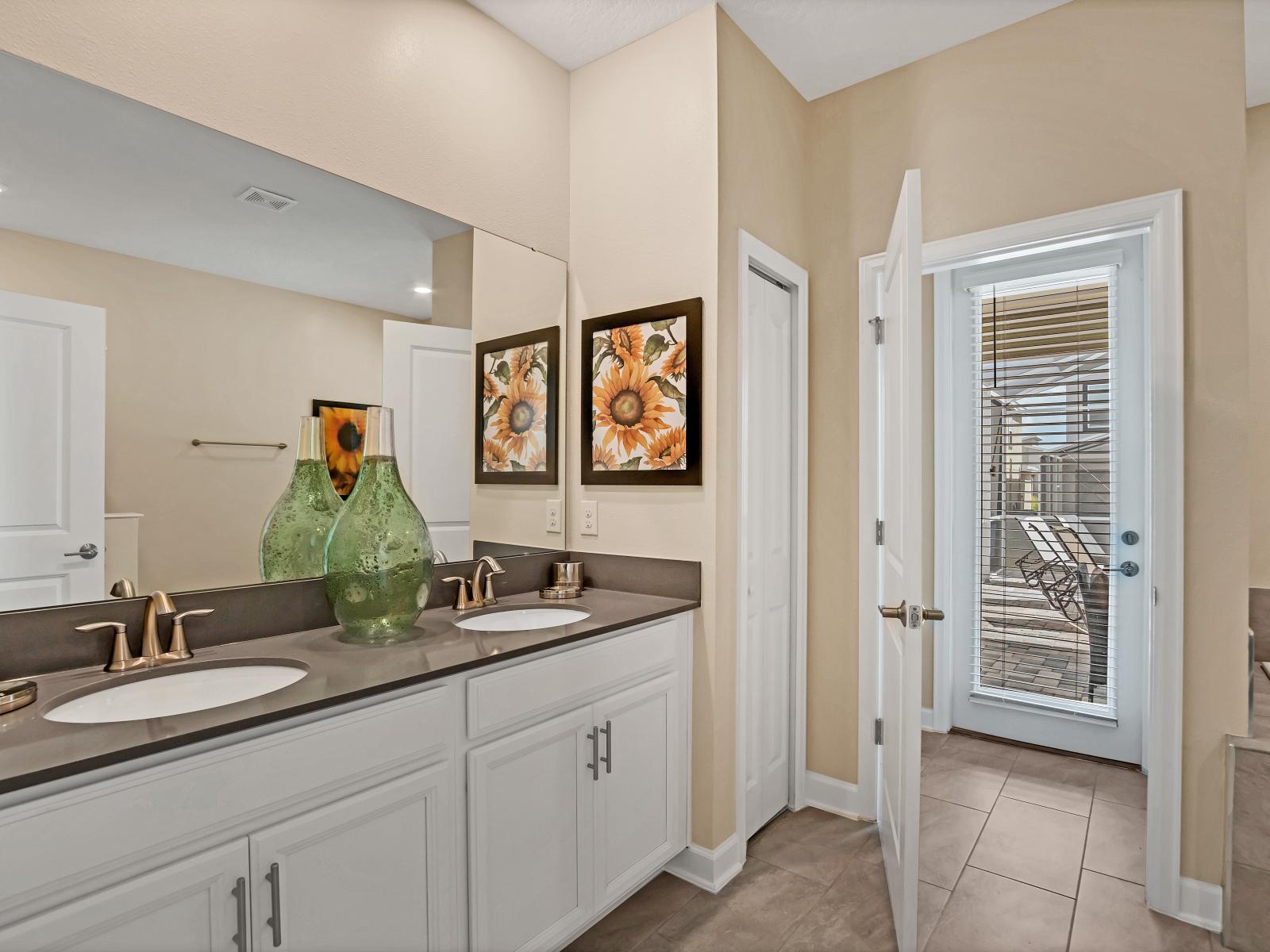 Pleasant Bathroom of the Home in Reunion Florida - Modern vanity area is a stylish sanctuary to indulge preparation - Attention to detail, from the elegant tiles to the faucets