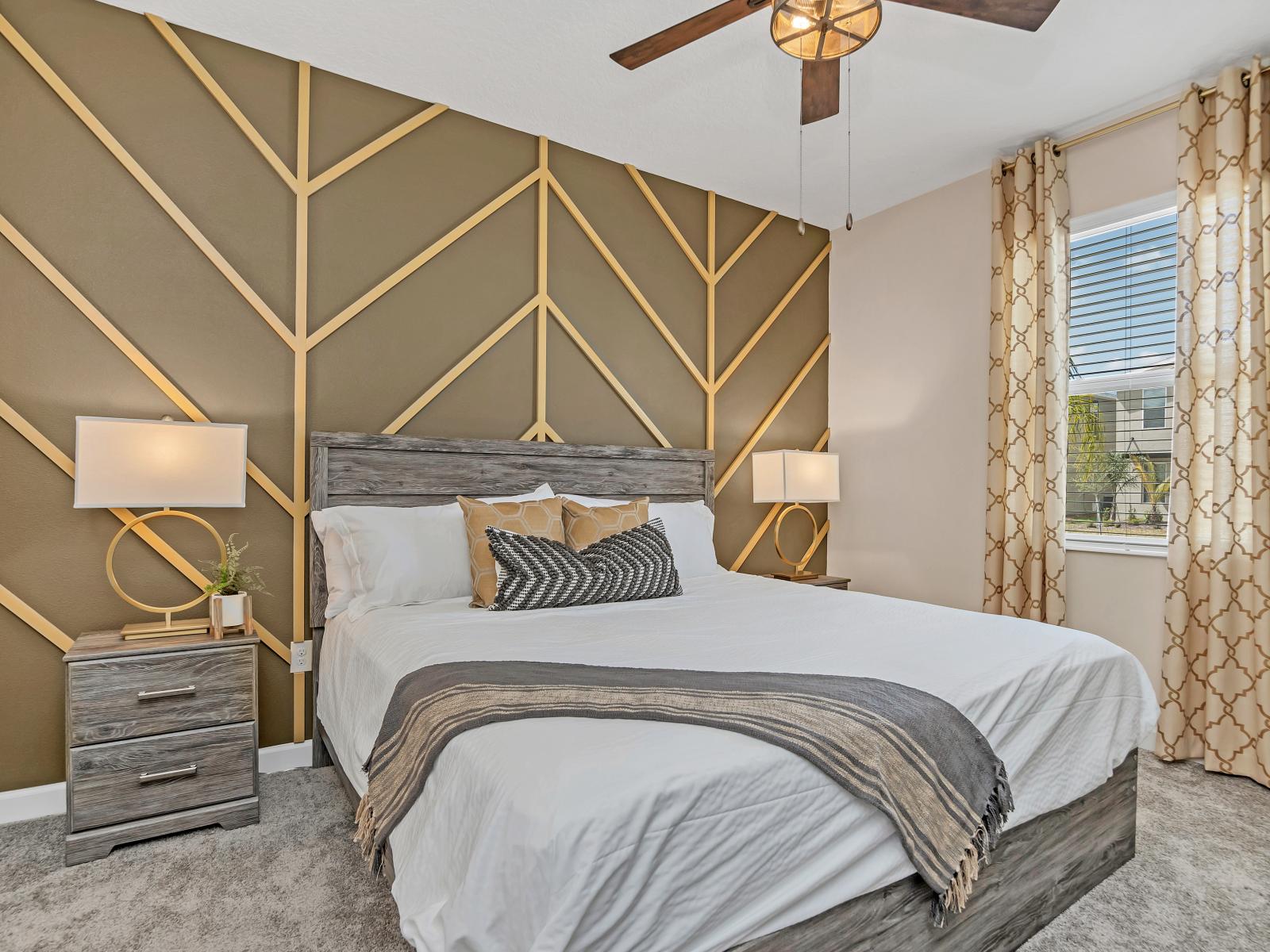 Deluxe bedroom of the Home in Reunion Florida - Spacious bedroom offering comfort and style - Cozy retreat with a plush bed, perfect for relaxation - Lush table lamps and decor