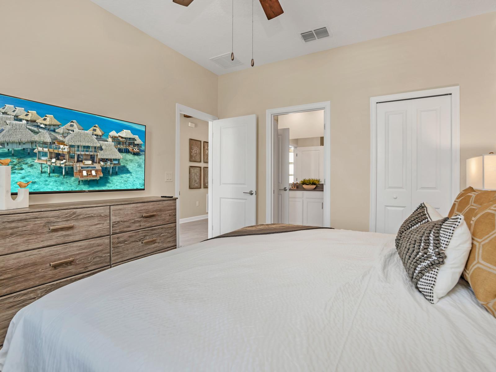 Alluring Bedroom of the Home in Reunion Florida - Bedroom with uncluttered spaces, crisp linens, and modern furnishings - Serene retreat for rest and relaxation during their stay - Smart TV and Netflix