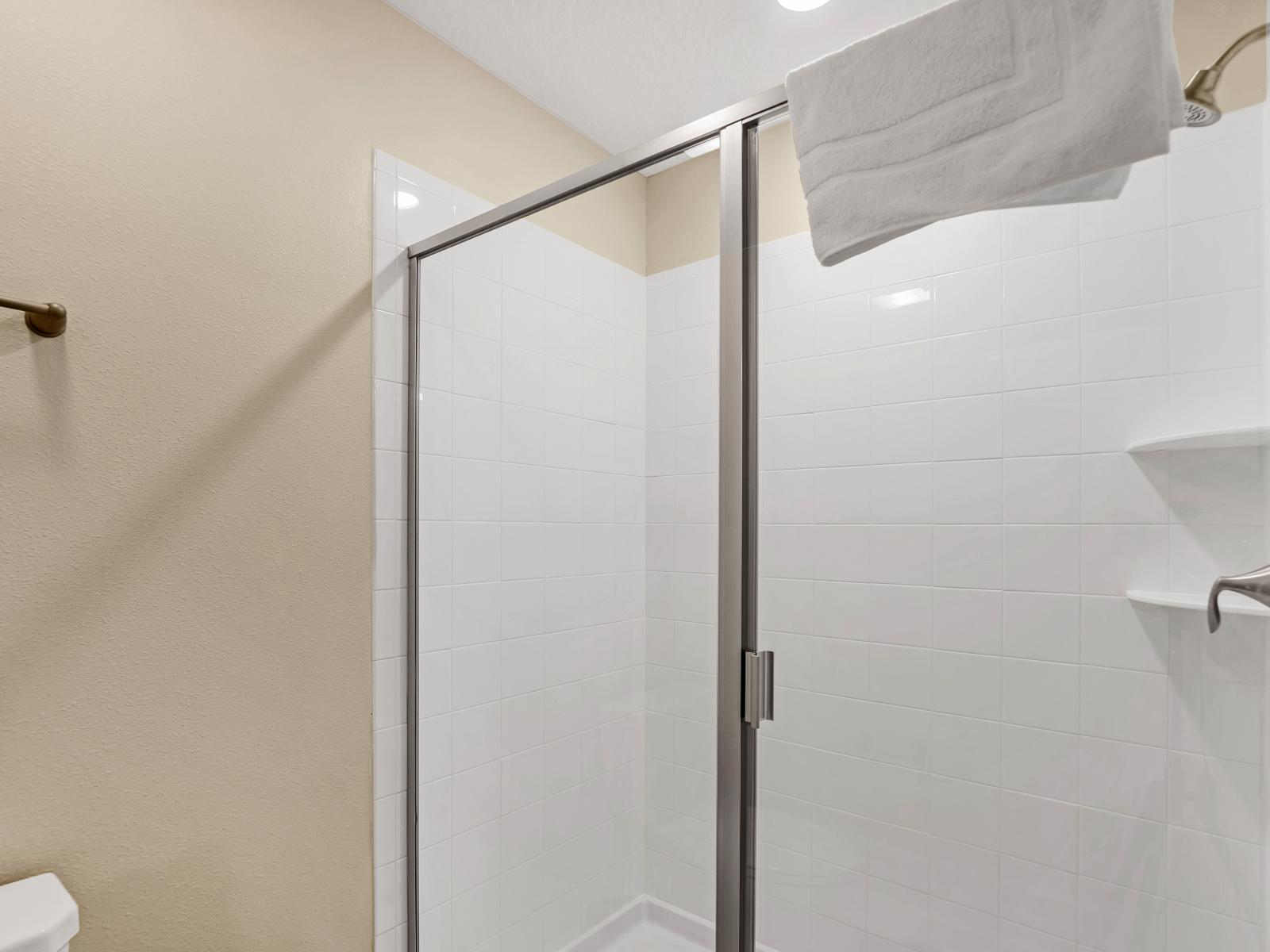 Elegant shower room- With sleek design, modern fixtures, and spacious comfort, it's a rejuvenating retreat where guests can wash away the day's stresses and emerge feeling refreshed and revitalized.