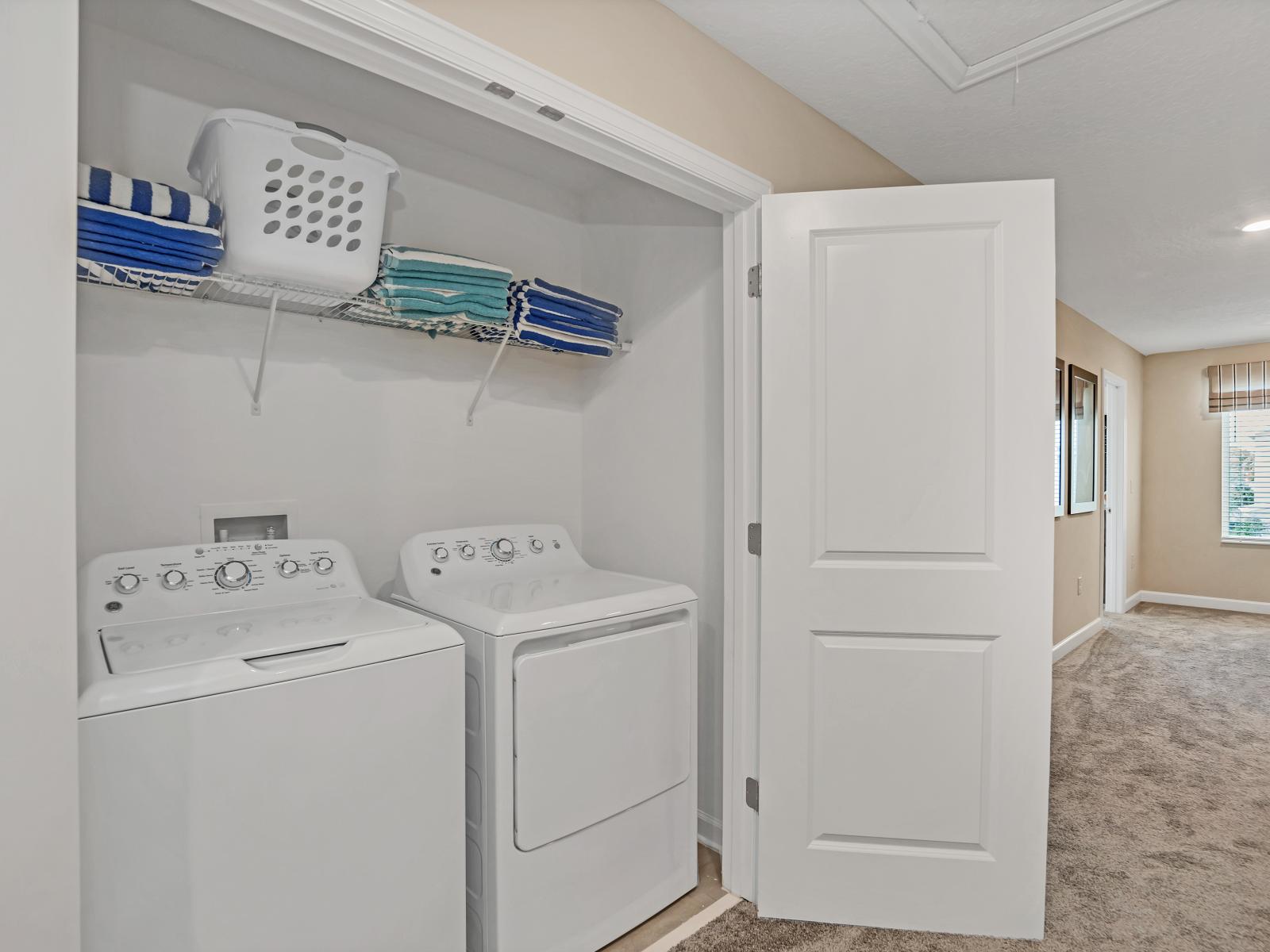 Laundry Area of the Home in Reunion Florida - The washer and dryer provides  the convenience of being able to freshen up  - Ensuring a hassle-free and comfortable experience