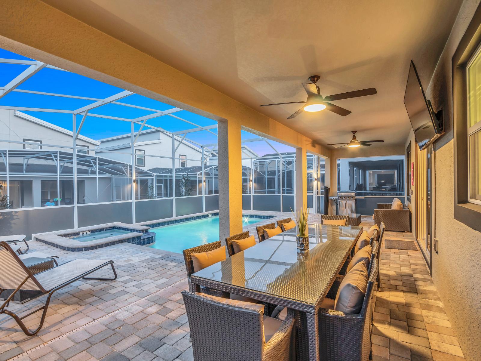 Outdoor Dining Area of the Home in Reunion Florida - Enjoy the ultimate escape with your own private pool - By a stylish dining area and comfortable lounges  - Dining al fresco - Smart TV and Netflix