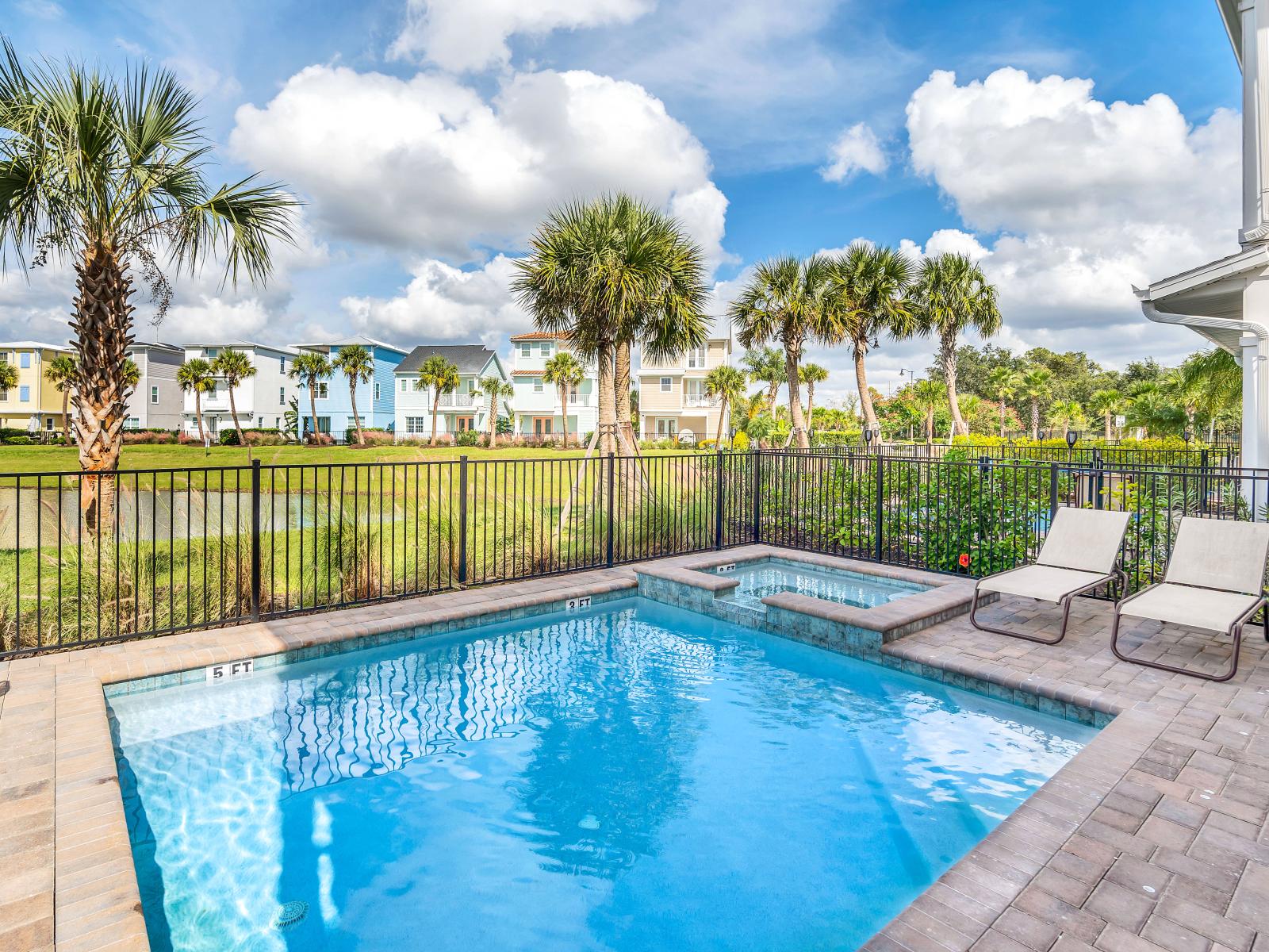 Sun-soaked Elegance: Bask in the glory of our outdoor swimming pool, where every moment is a picture-perfect escape, complemented by cozy lounge chairs for your utmost comfort.