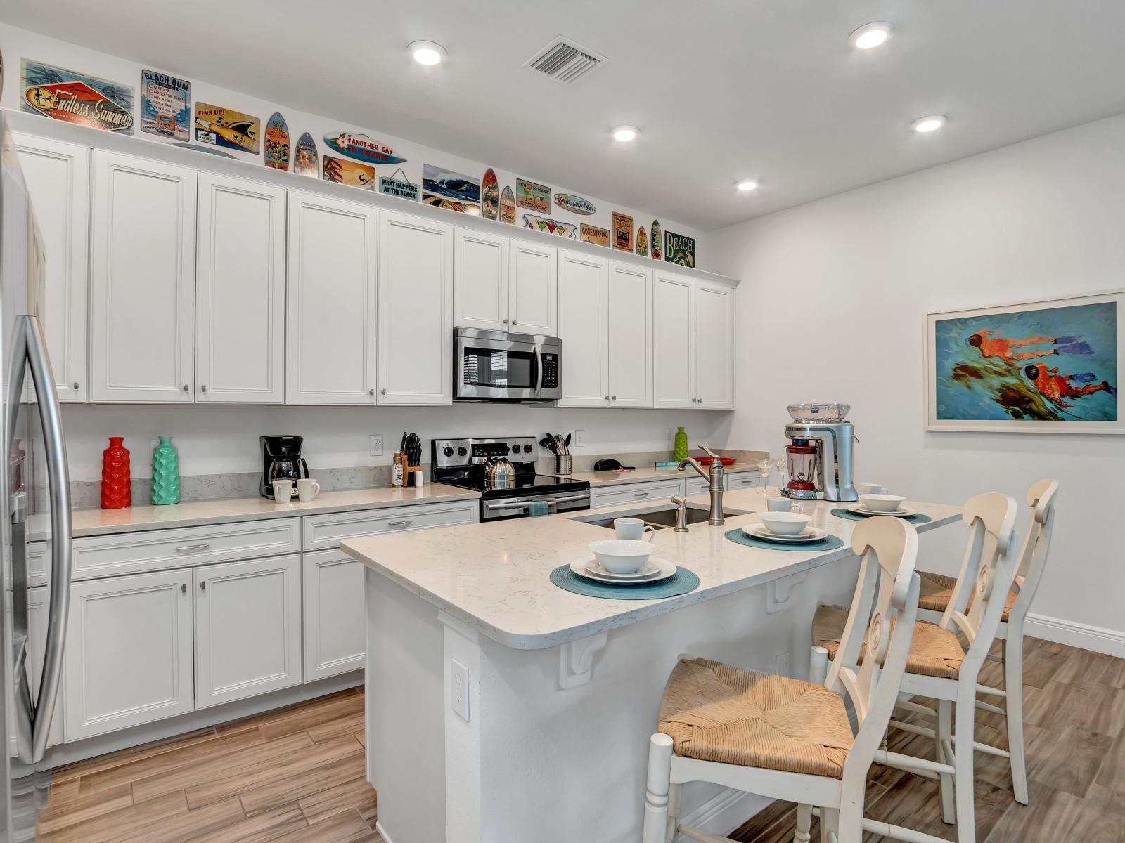 Sleek kitchen of the cottage in Kissimmee Florida - Infusing a sense of contemporary style and airiness into - Integrated appliances for a seamless and stylish appearance - Well-lit workspace with strategically placed task lighting