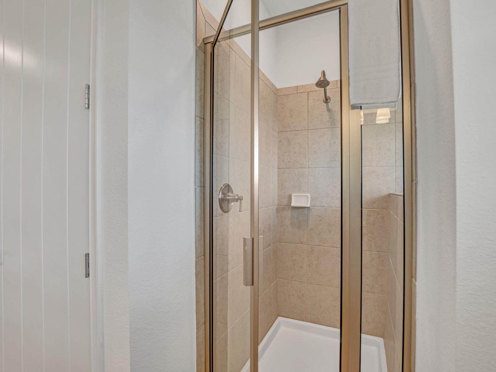 Tiled walk-in shower area of the cottage in Kissimmee Florida - Rejuvenate in style - Where a deep soaking sleek walk-in shower provide the perfect balance of indulgence and convenience