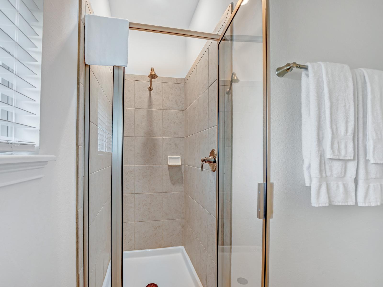 Sleek Shower Sanctuary: Step into sleek sophistication in our bathroom, featuring a stylish walk-in shower for a refreshing and rejuvenating experience.