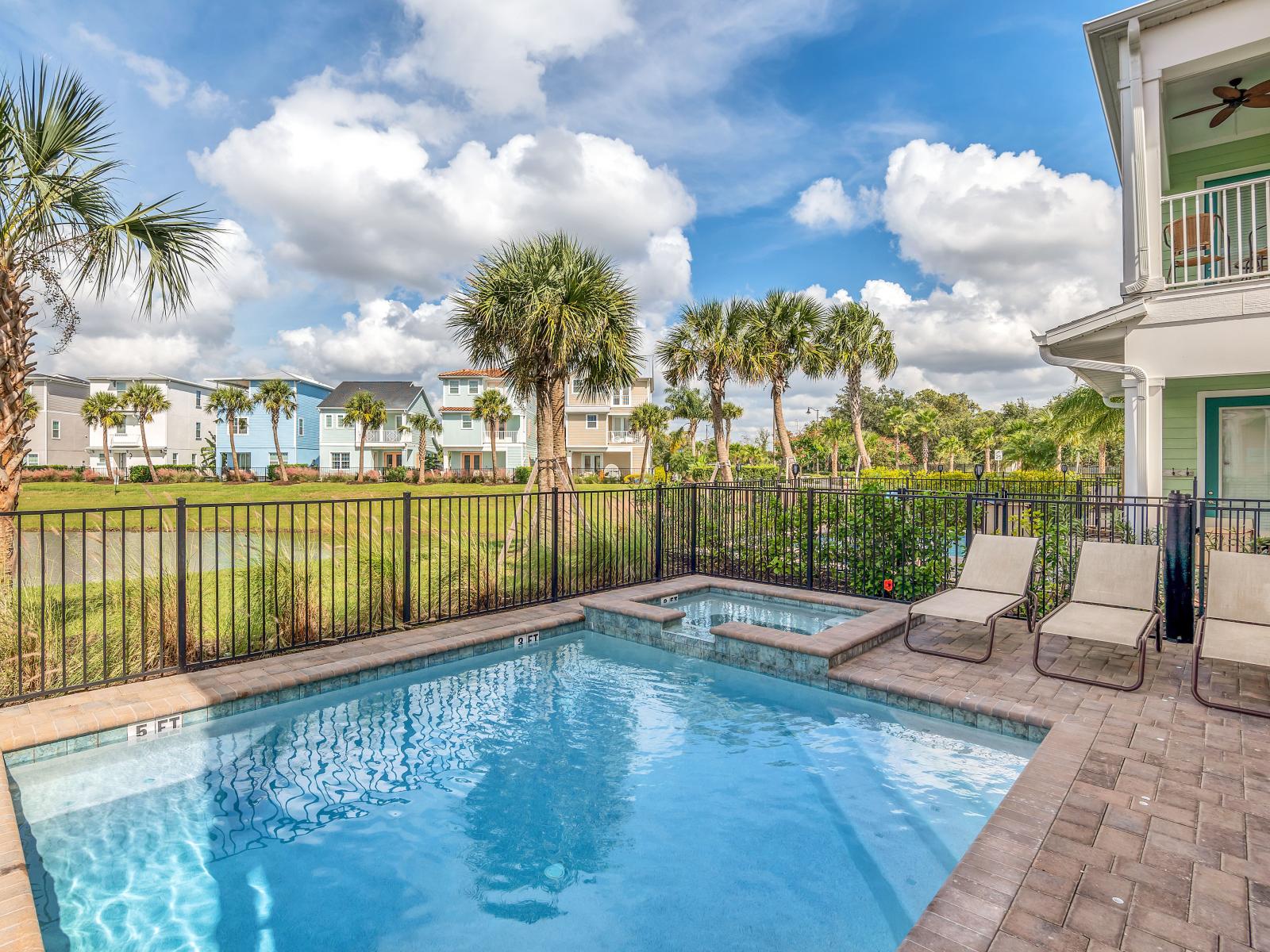 Sun-soaked Elegance: Bask in the glory of our outdoor swimming pool, where every moment is a picture-perfect escape, complemented by cozy lounge chairs for your utmost comfort.