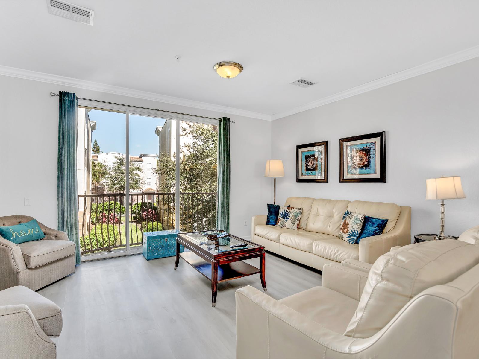 Inviting Living Room: Enjoy a breath of fresh air as you open the sliding doors in this refreshing townhouse space.