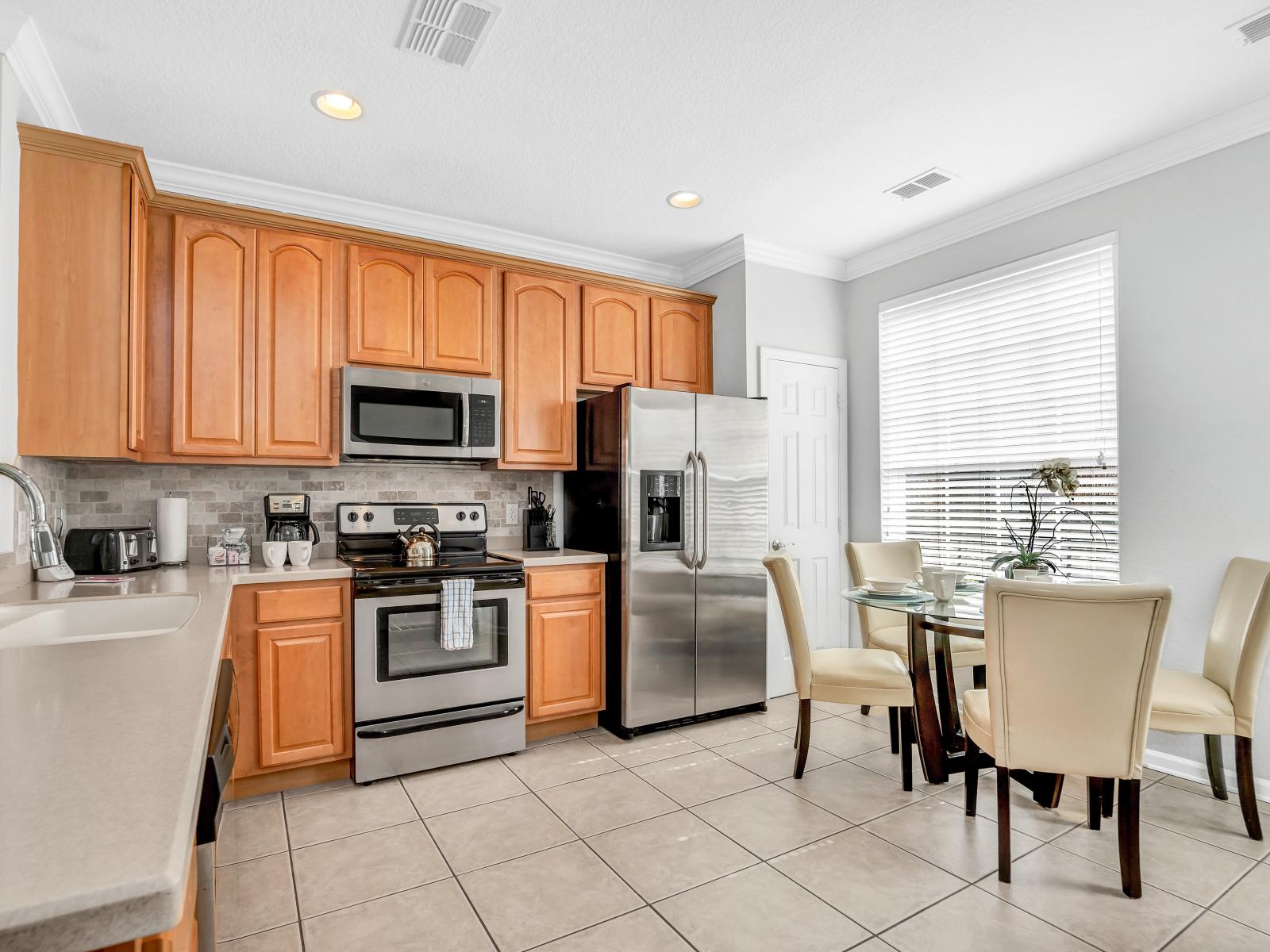 The Heart of the Home: This townhouse features an open-concept kitchen seamlessly connected to the dining area, making it effortless to serve and enjoy your meals.