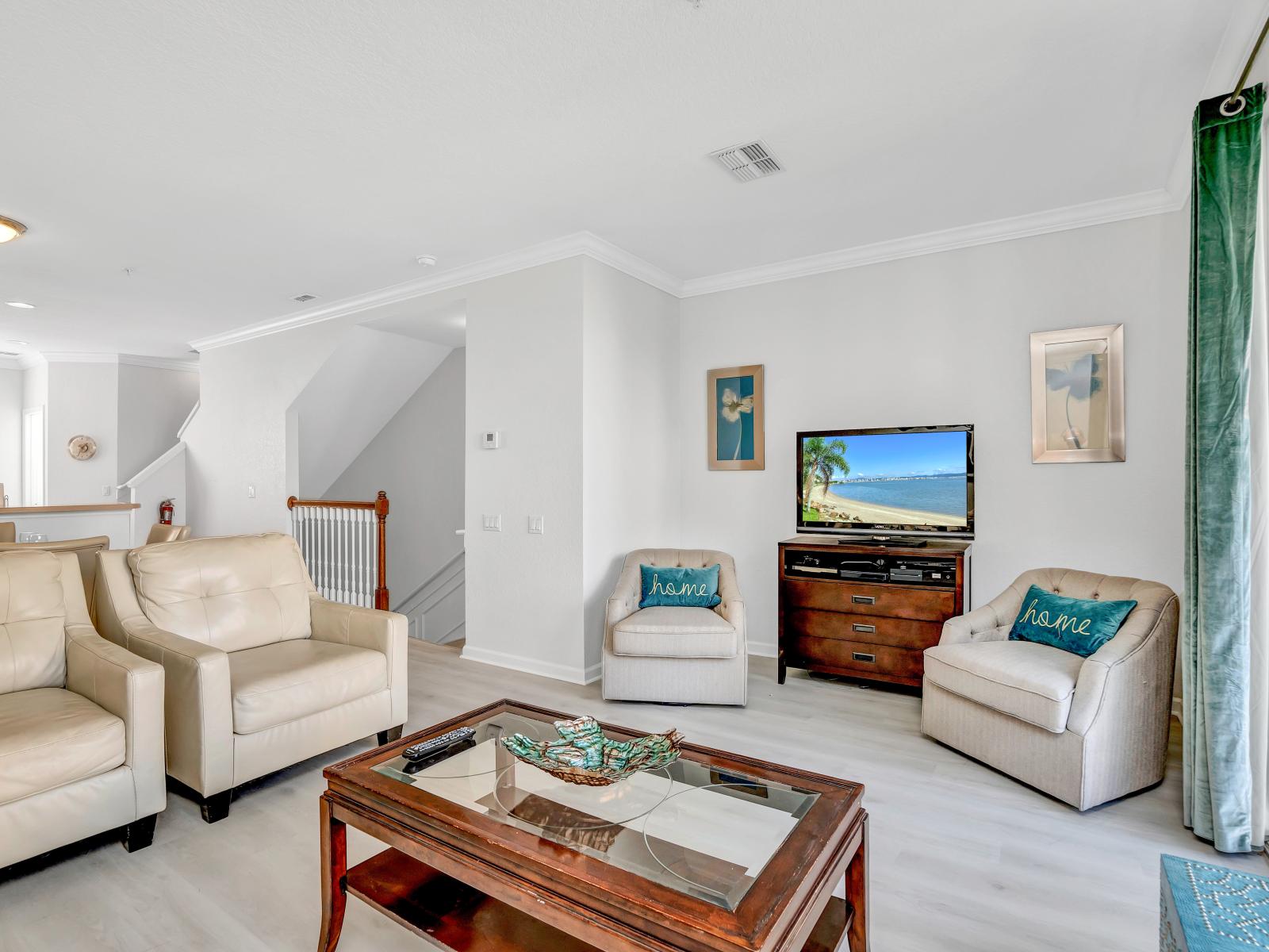 Inviting Living Space: Step into this refreshing townhouse area where sliding doors beckon, offering the option to let in a breath of fresh air, creating a rejuvenating atmosphere for relaxation and unwinding.