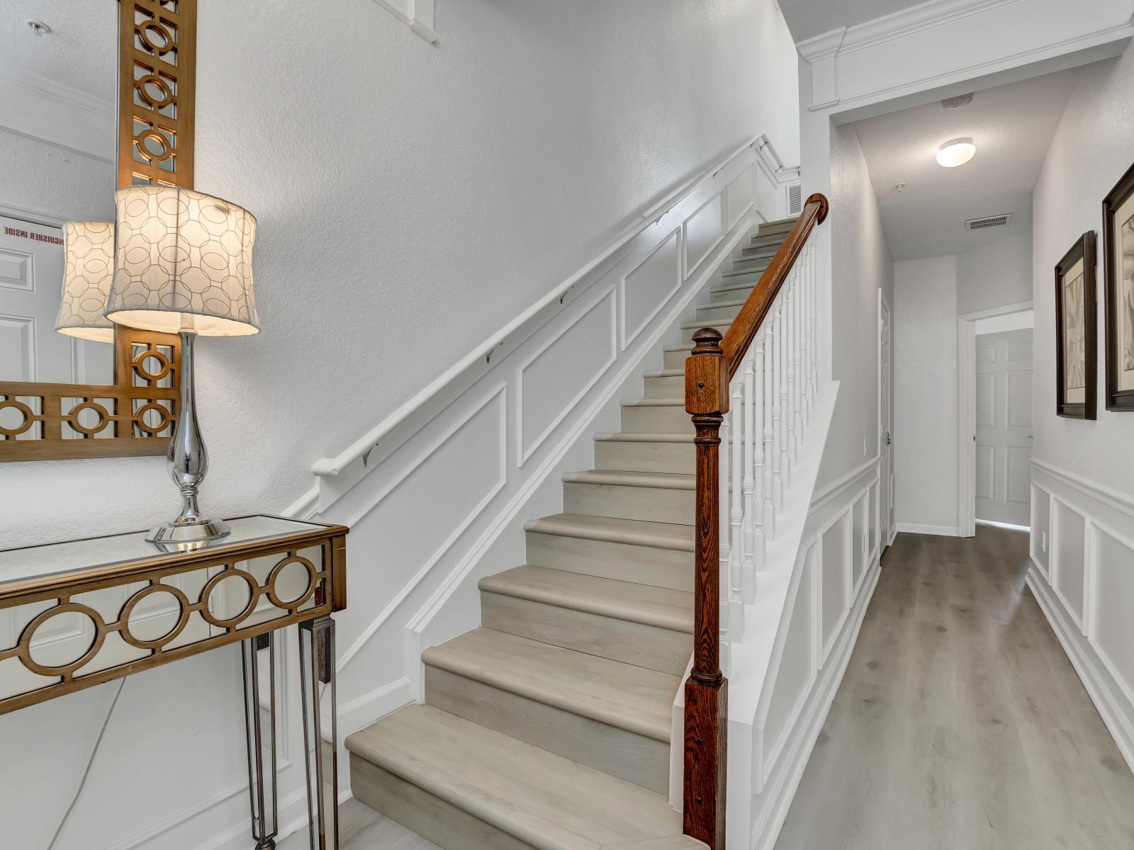 Ascend to Serenity: These stairs lead you to the tranquil second-floor rooms, offering comfort and privacy for a peaceful retreat.