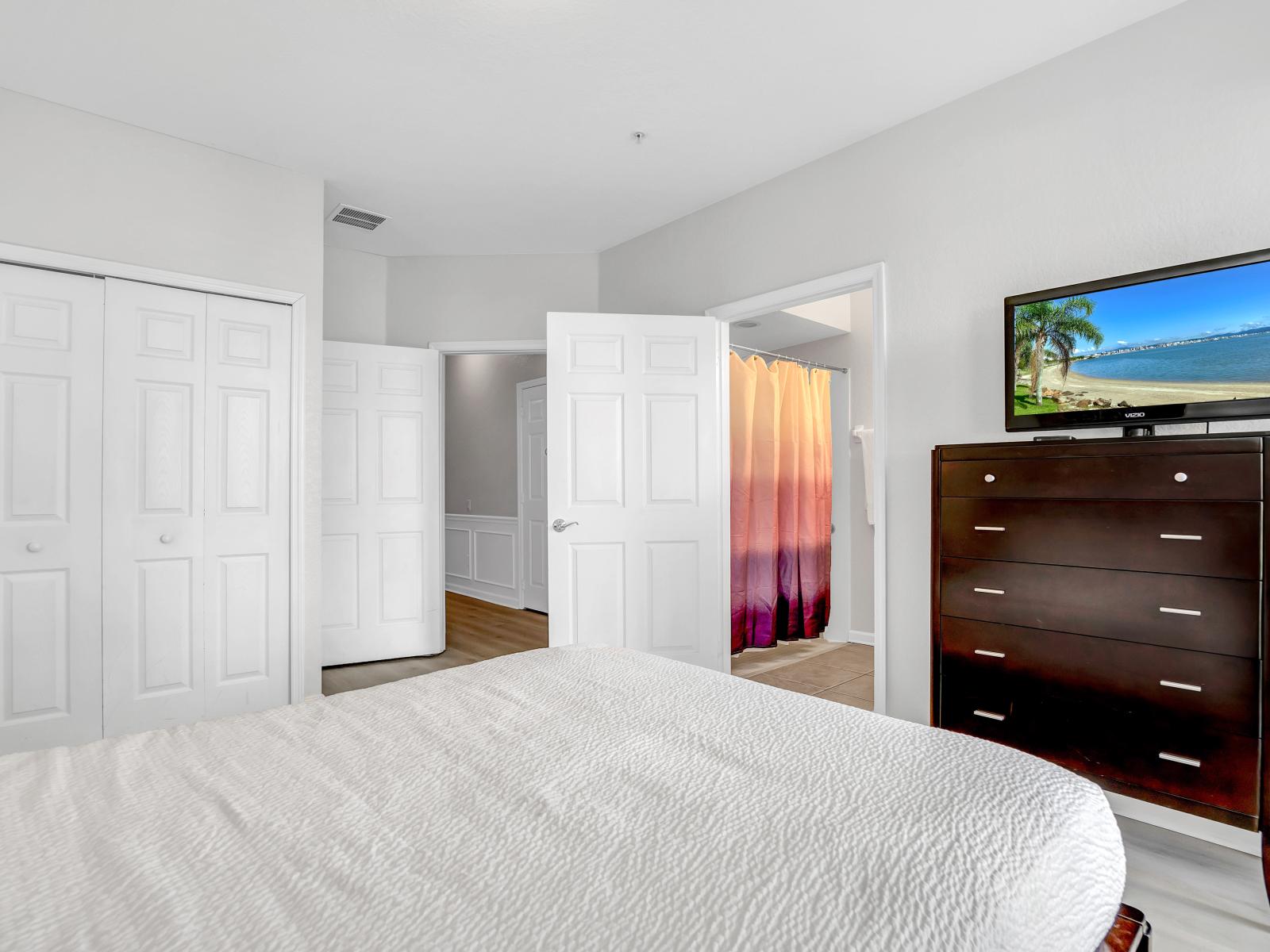 Entertainment Haven: Relax in this inviting bedroom retreat, complete with a TV for your viewing pleasure. Unwind in comfort and style as you enjoy your favorite shows and movies in this cozy sanctuary.