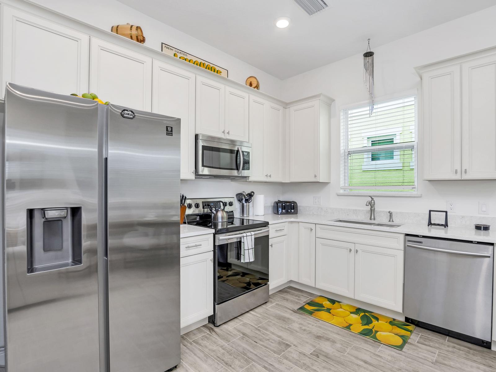 - Stylish Kitchen of the cottage in Florida - Step into the sleek ambiance of the kitchen - It  creates a modern and inviting space for culinary adventures - Thoughtful placement of kitchen essentials for easy access