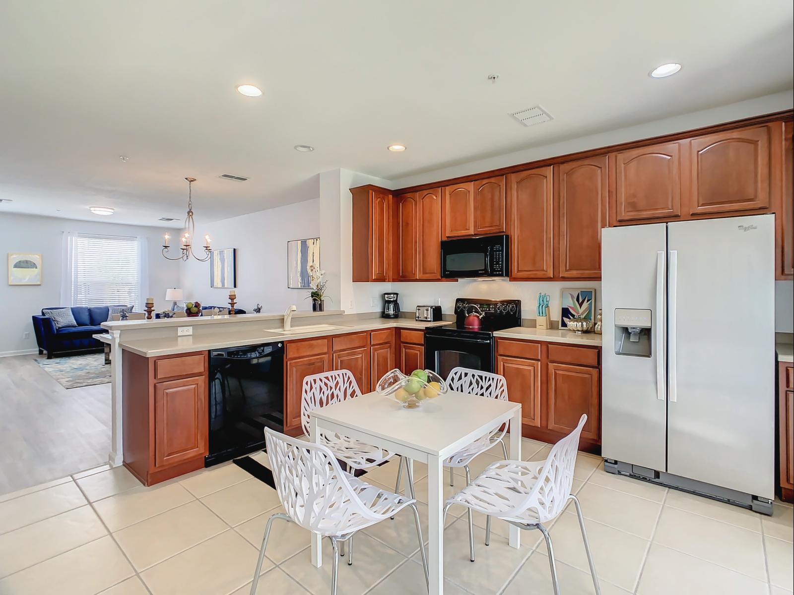 This fully equipped kitchen boasts an open concept design, flooded with natural light from the outside, ensuring a delightful cooking experience.