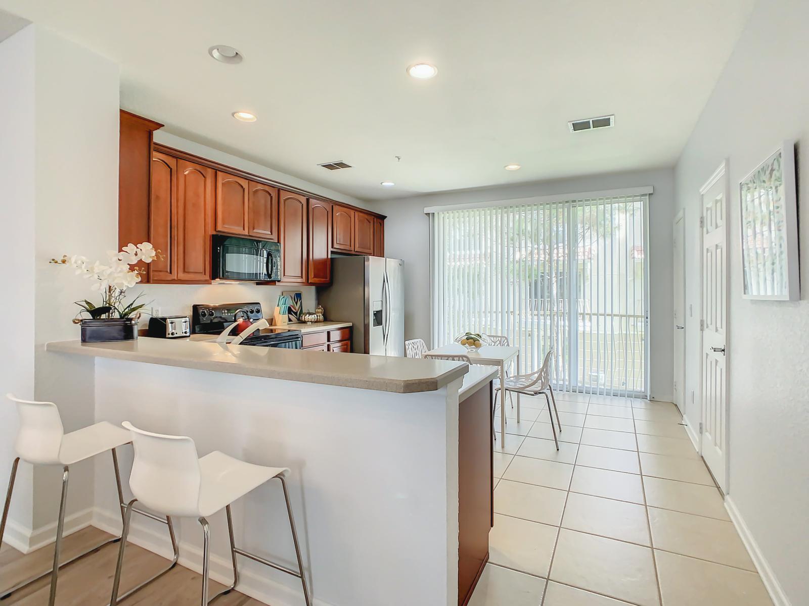 Our fully equipped kitchen boasts an open-concept design, flooded with natural light from the outside, making meal preparation a delightful experience.