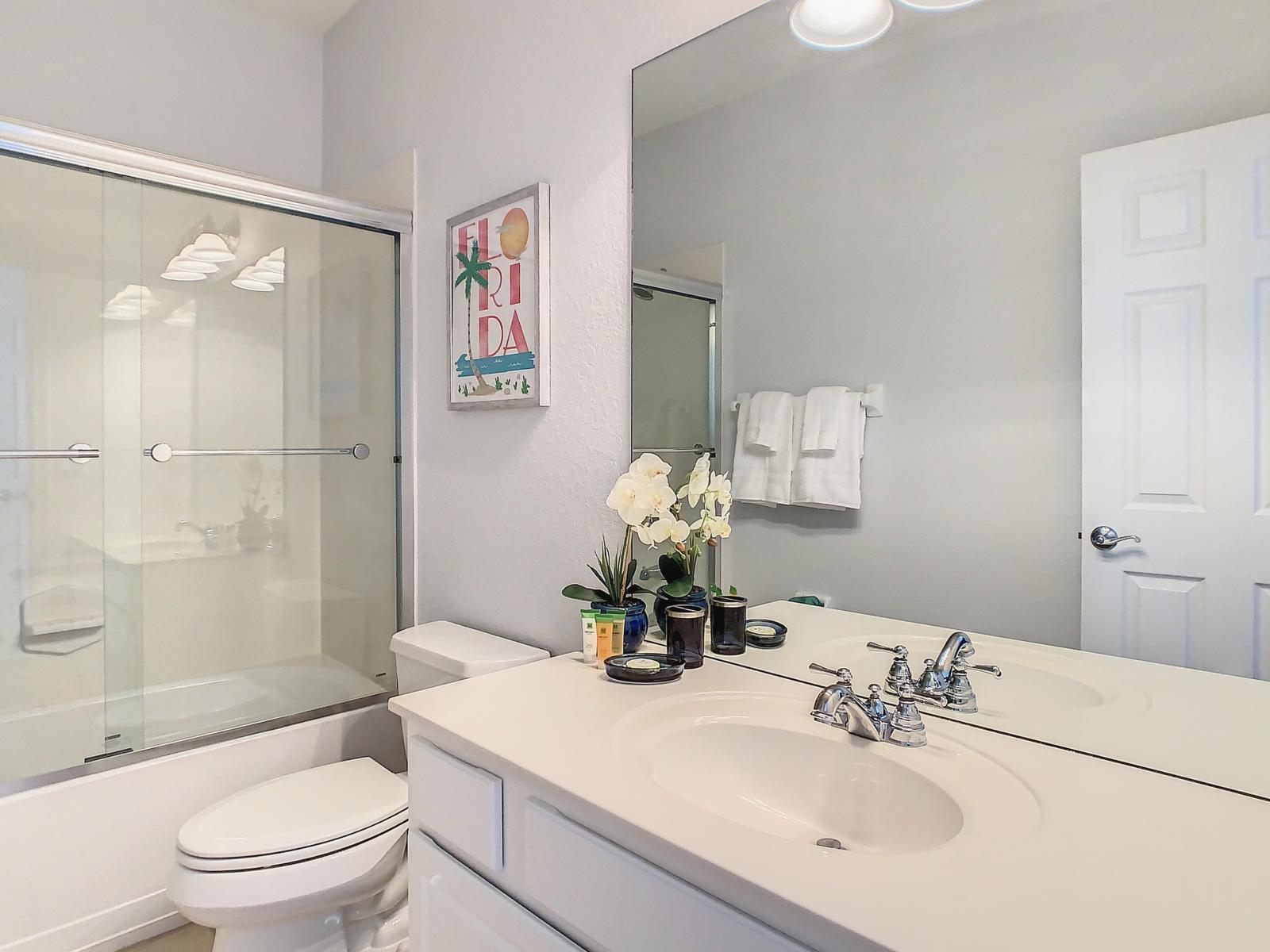 Refresh in the second bathroom equipped with a tub/shower combination, offering convenience and functionality.