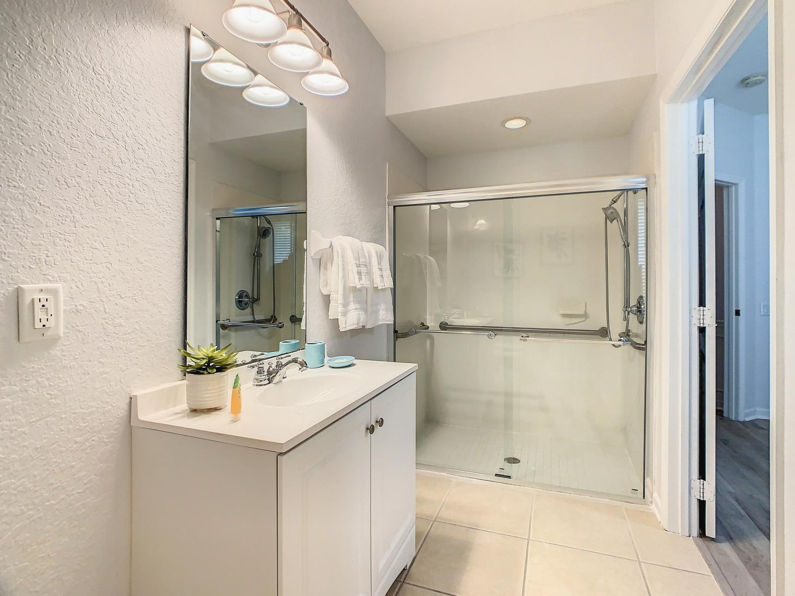 Refresh in the third bathroom's walk-in shower, offering a hassle-free bathing experience for added convenience.