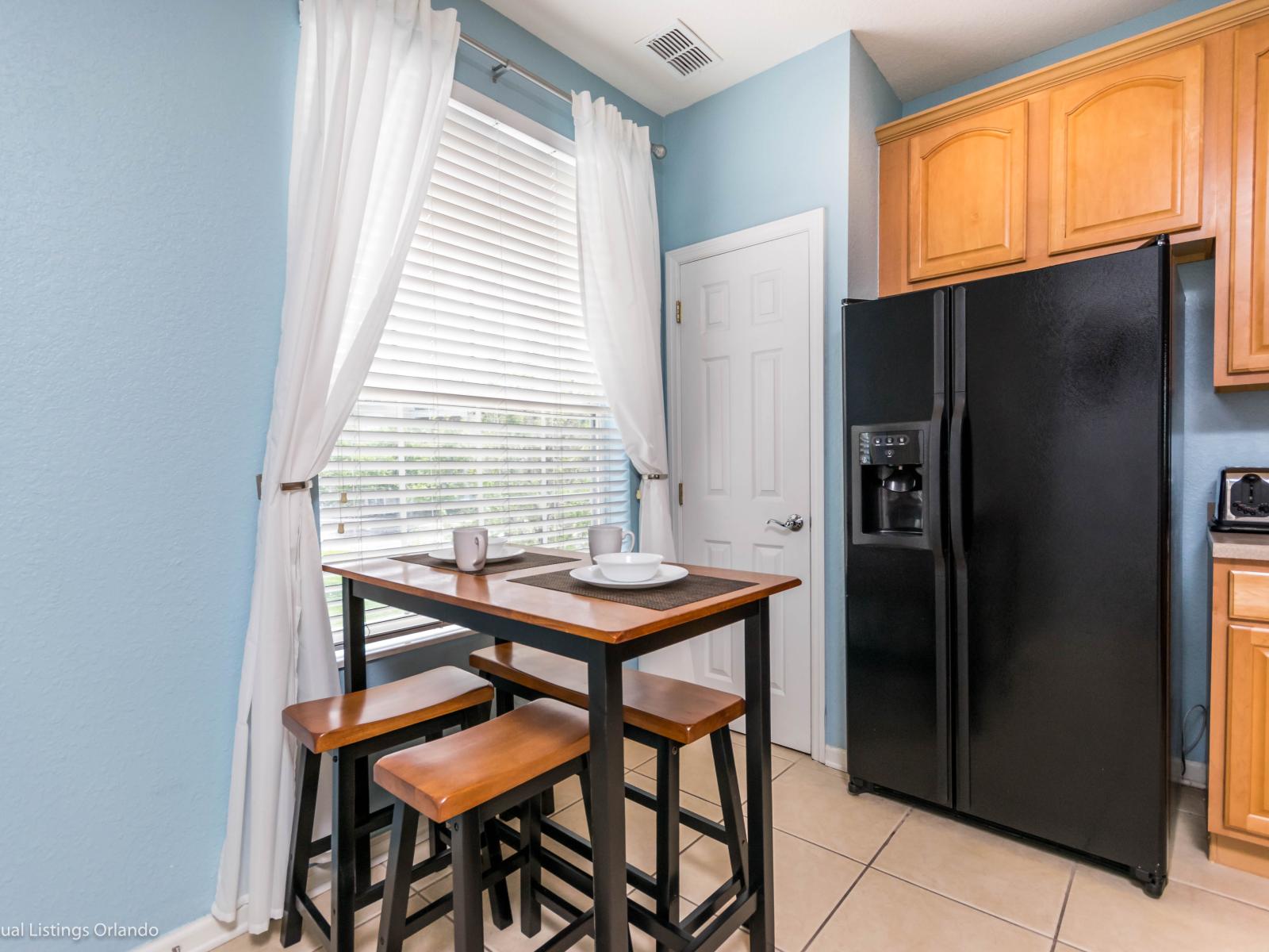 Discover the pleasant sitting area in the kitchen of our apartment, seamlessly blending functionality with aesthetics. The elegant table setting sets the stage for sophisticated dining experiences, while panoramic views offer a delightful backdrop.