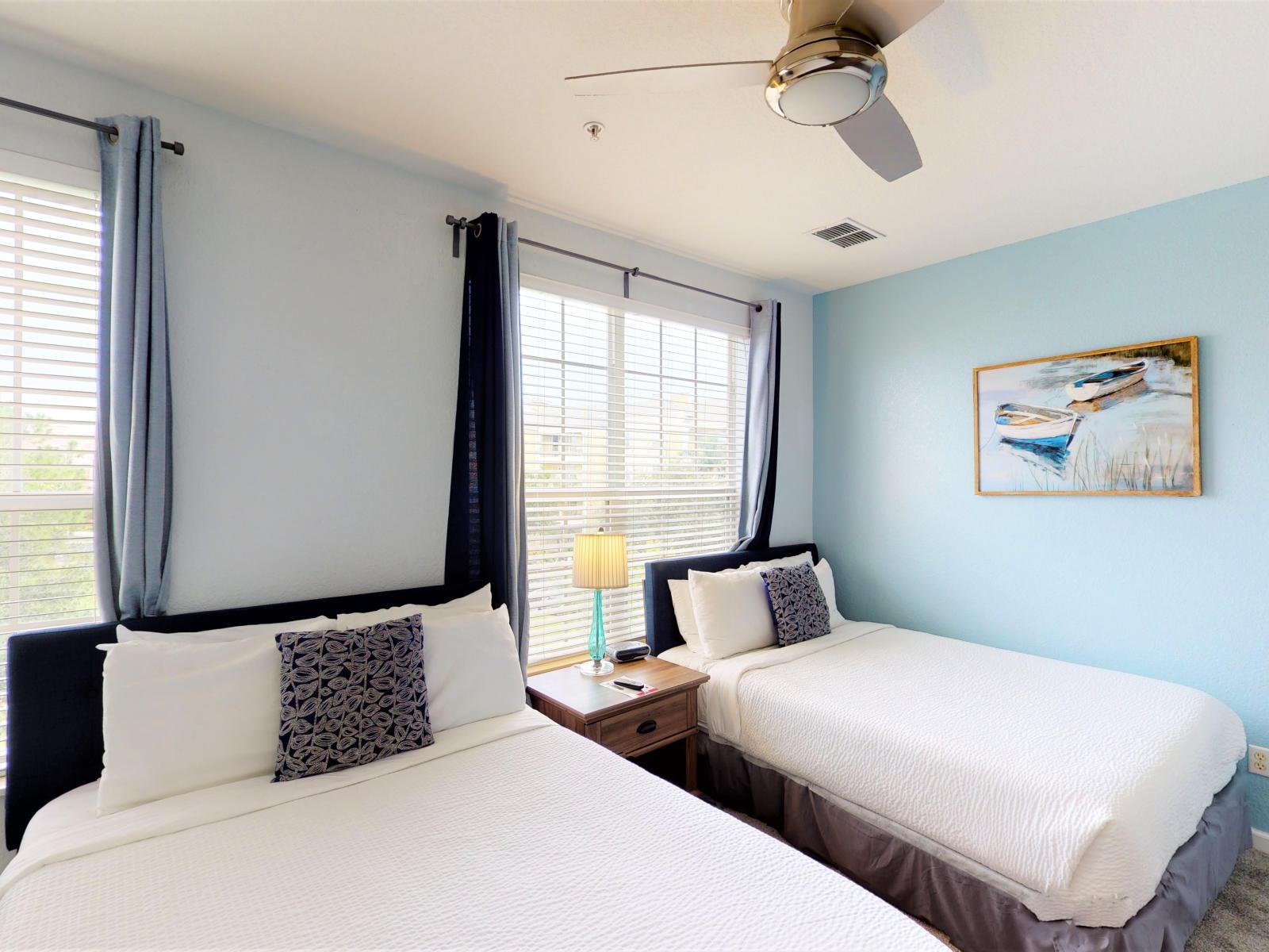 Welcome to the lush bedroom of our Orlando, Florida apartment, where twin comfy beds await. Luxurious bedding promises a restful night's sleep, while the inviting atmosphere is designed for rejuvenation and relaxation.