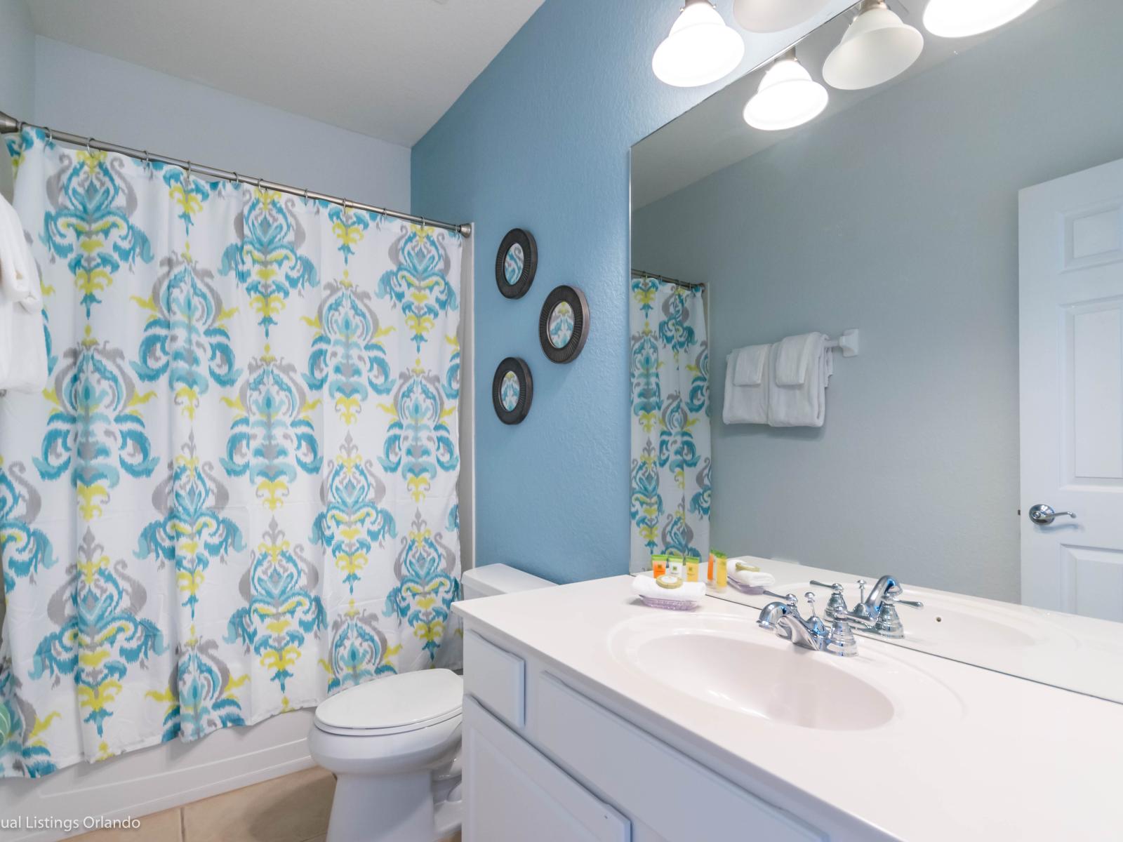 Step into the refined bathroom of our Orlando, Florida apartment, where chic design meets tranquil ambiance. With a sleek vanity, upscale lighting, and stylish cabinets offering thoughtful storage solutions, every detail exudes sophistication.