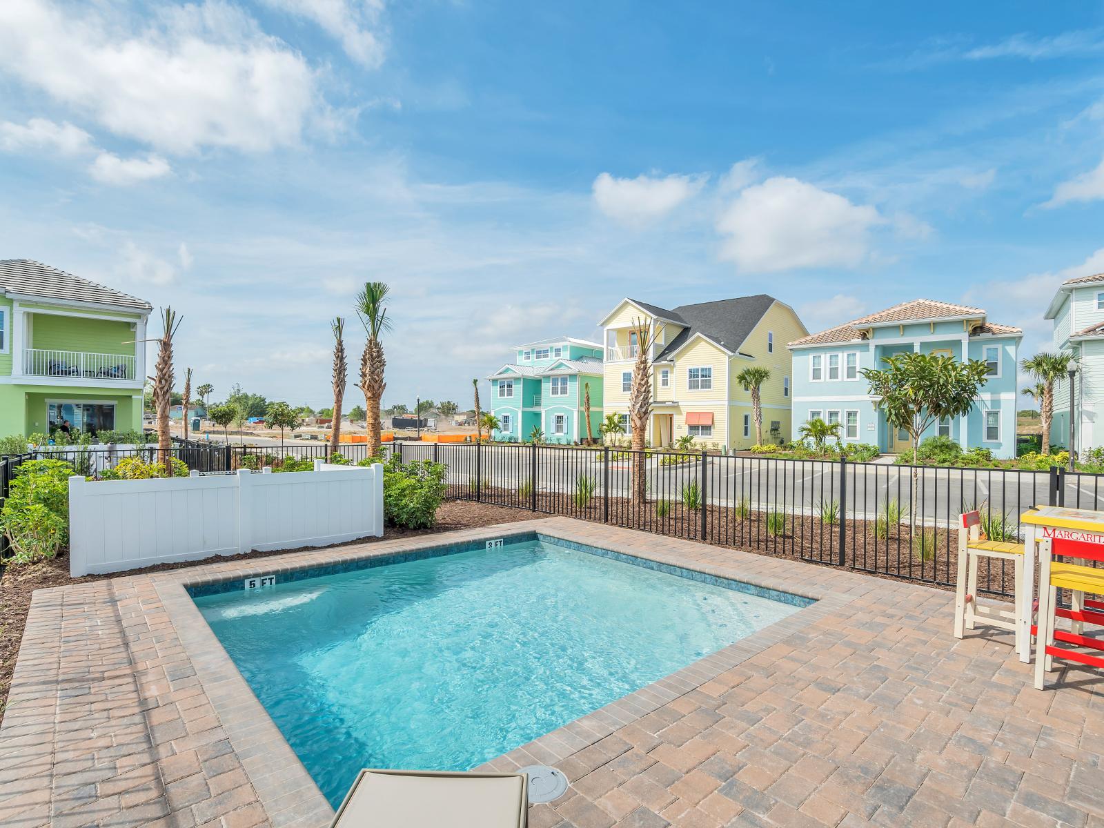 Sun-soaked Elegance: Bask in the glory of our outdoor swimming pool, where every moment is a picture-perfect escape, complemented by cozy lounge chairs for your utmost comfort.