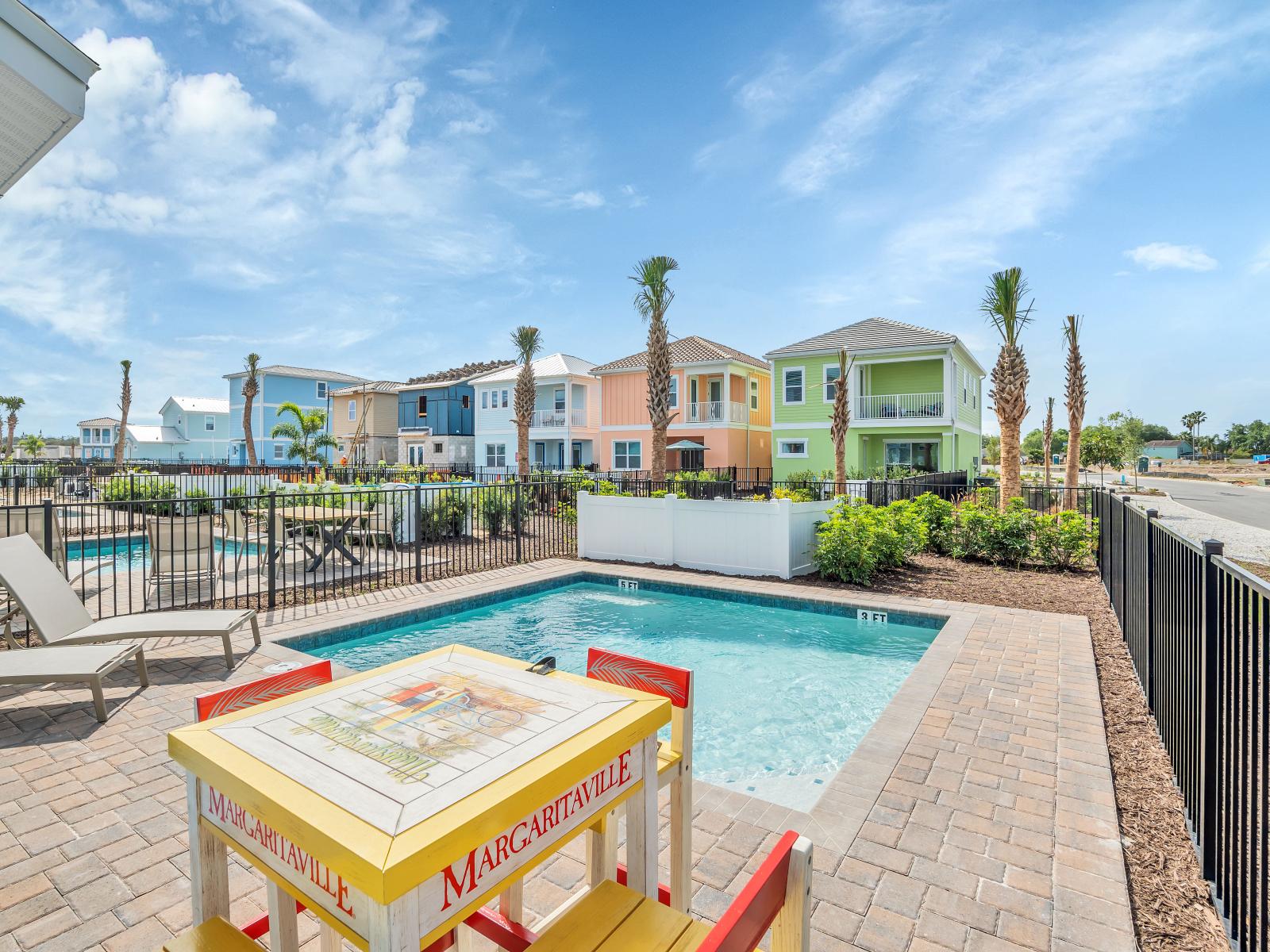 Sun-soaked Elegance: Bask in the glory of our outdoor swimming pool, where every moment is a picture-perfect escape, complemented by cozy lounge chairs for your utmost comfort.