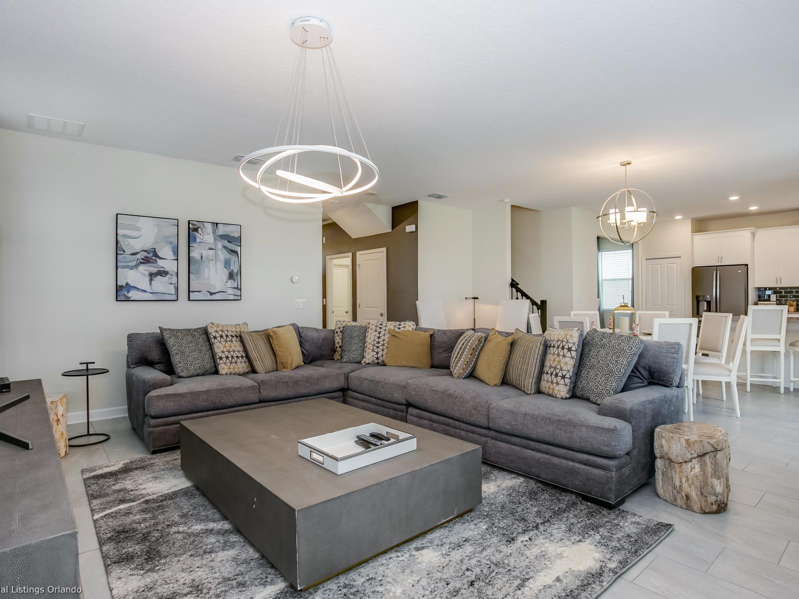 - Spacious Living Area of the Home in Florida - Artfully arranged decor elements, from wall art to decorative accessories - Open-concept living area seamlessly connected to a stylish dining space and kitchen - Smart TV and Netflix