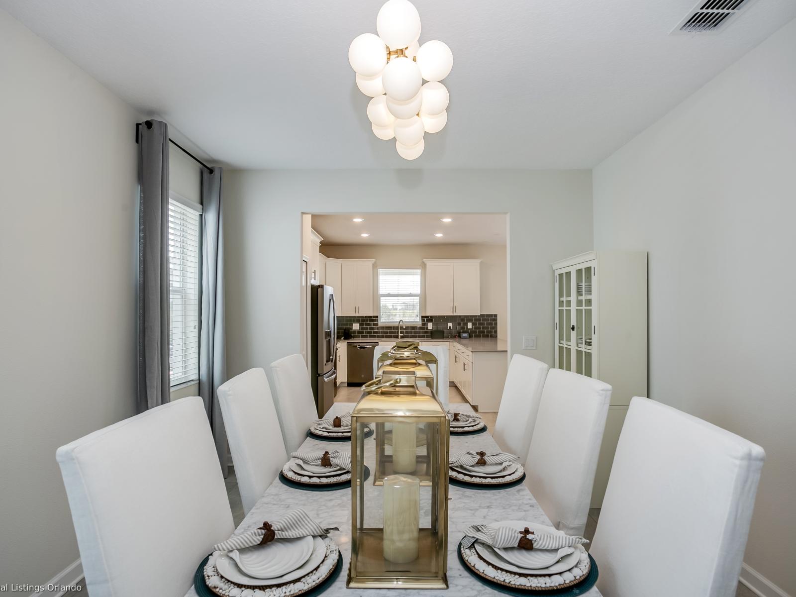 - Posh Dining Area of the Home in Florida - Clean lines and a crisp color palette - Creates a stylish and inviting space to gather, enjoy meals, and savor in a refined setting - Dining for 8 Persons