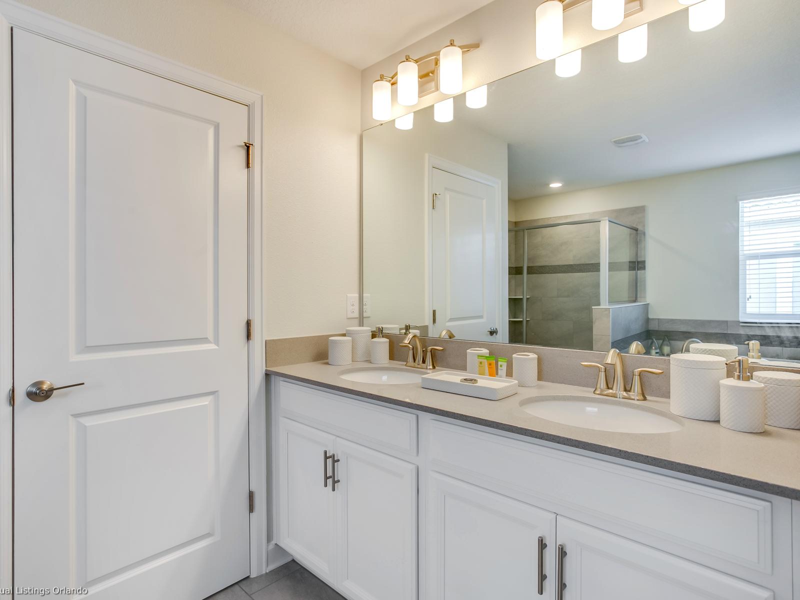 - Lavish Bathroom of the Home in Florida - Vanity area exudes timeless elegance and sophistication - Its clean lines and bright aesthetic - Elegant bathroom with luxurious fixtures and finishes