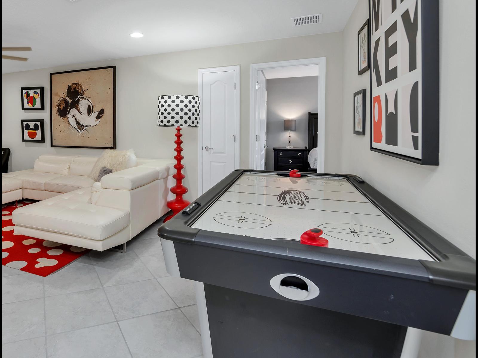 Loft with sitting space and air hockey game