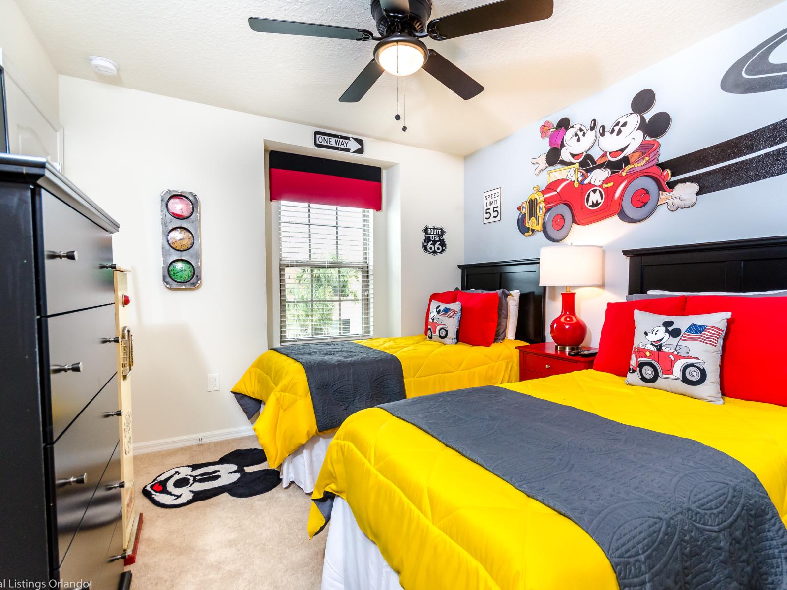 The Mickey and Minnie themed room for the kids is a whimsical wonderland, complete with two twin-size beds adorned with beloved characters. It's a magical retreat where imagination thrives and dreams come alive in the heart of Disney charm.