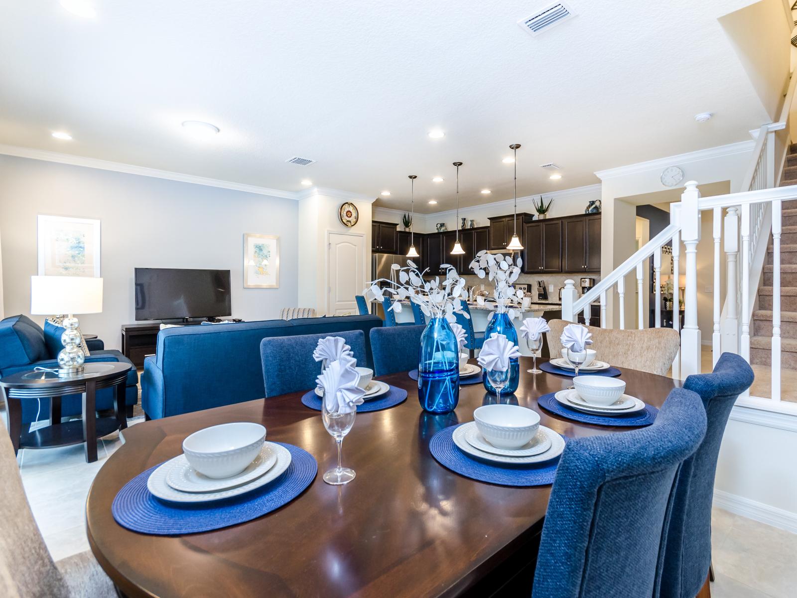 The dining and living area invites you to gather and unwind in comfort and style. A space where meals transform into cherished memories and relaxation becomes an art, promising moments of togetherness and joy.