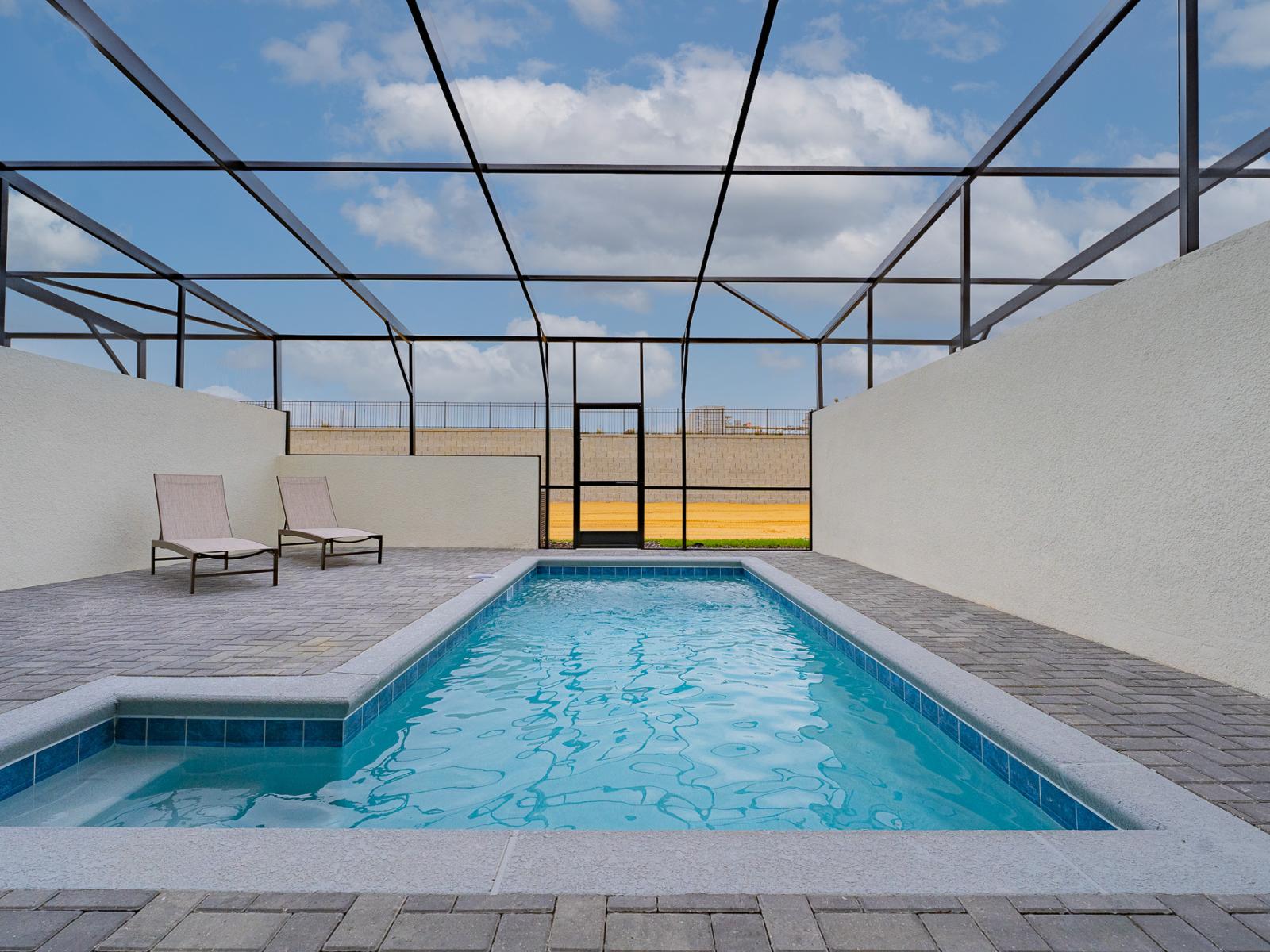 Breathtaking private pool of the home in Davenport, Florida - Enjoy unrivaled privacy as you swim under the stars in your private glass-covered pool - Chill out, decompress, and bask in the sun with panache