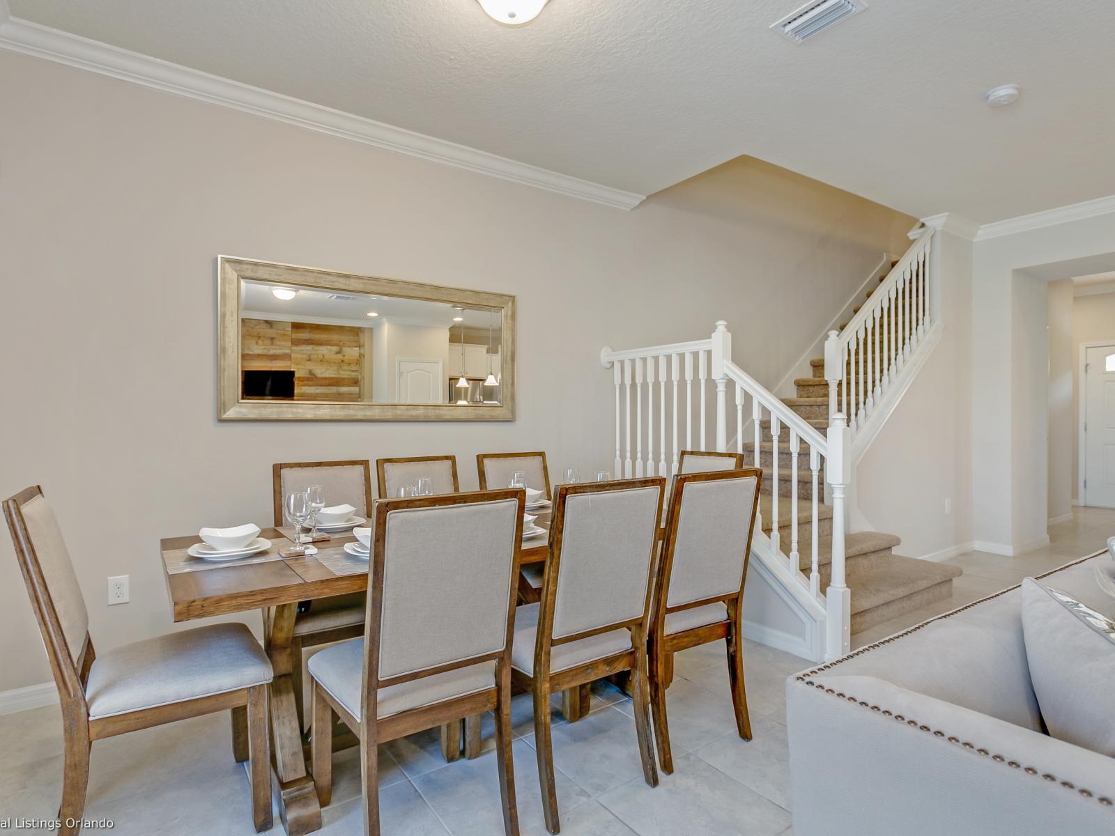 Classic 8 persons dining area of the townhouse in Kissimmee, Florida - This Dining area radiates charm, inviting shared moments and delightful meals - Minimalist décor, allowing the focus to remain on the dining experience