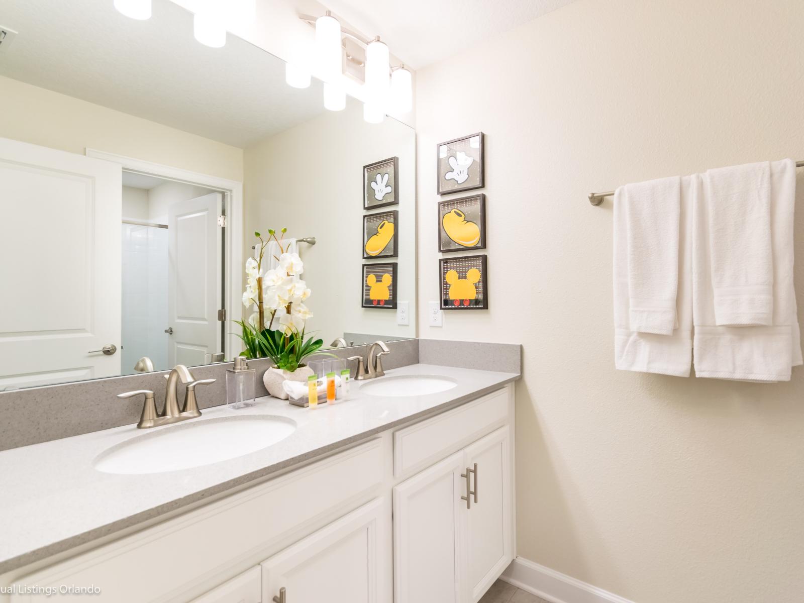 Bathroom 2 with double vanity and tub/shower combination