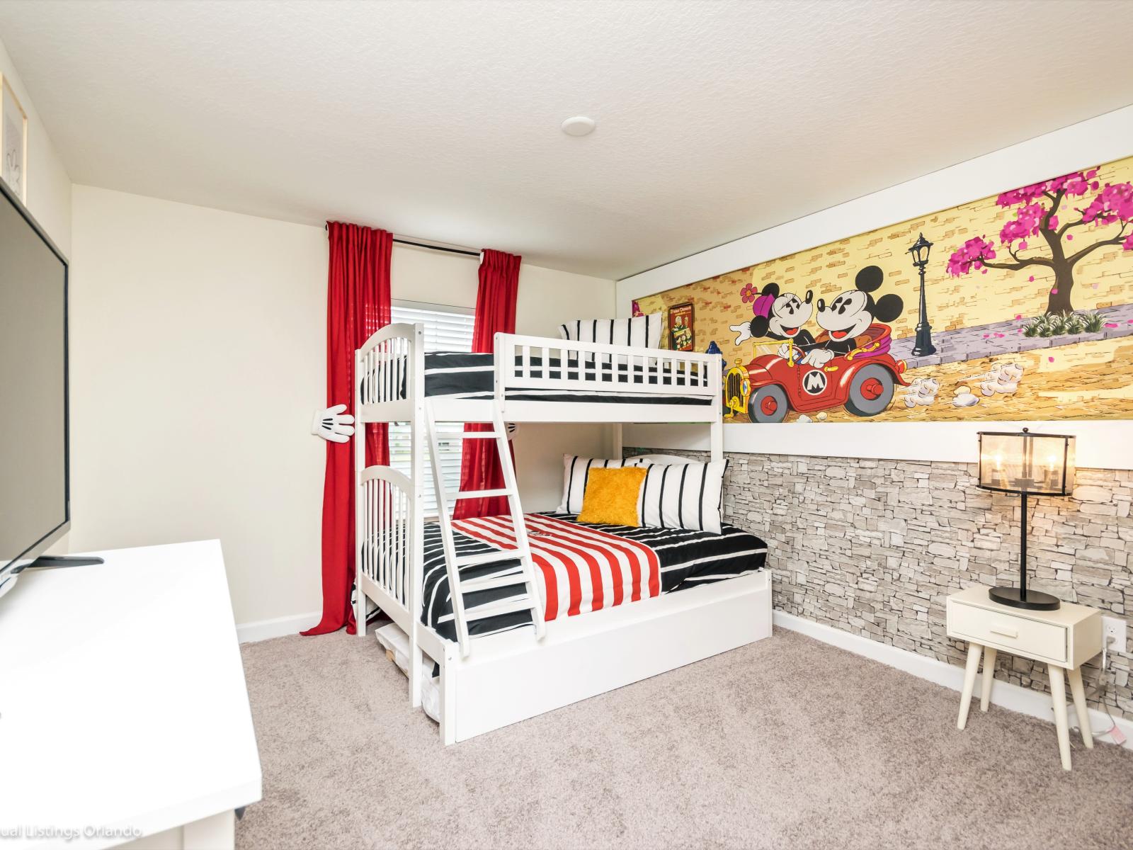 Bedroom 3: Mickey themed kids room with single over double bunk bed