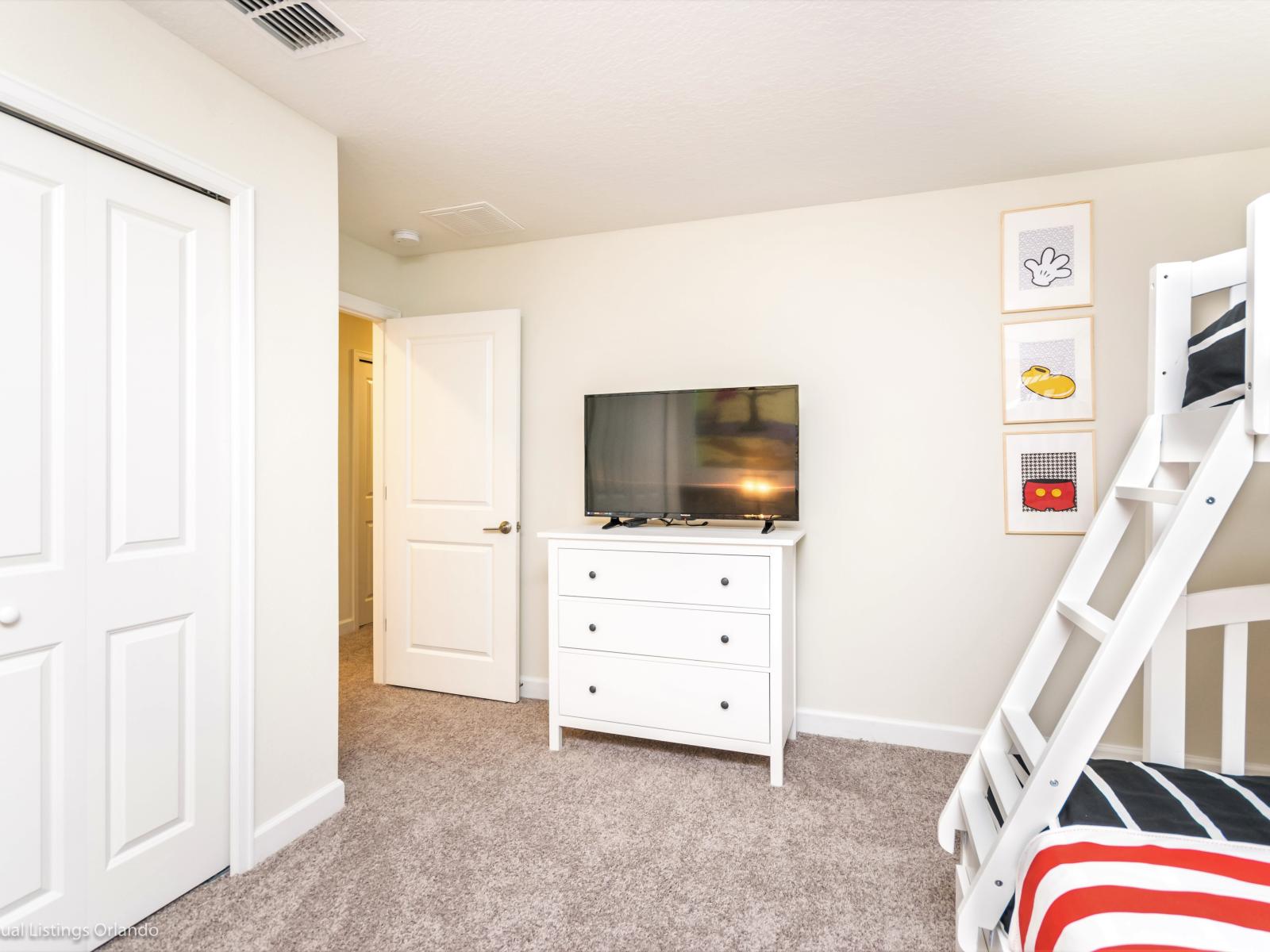 Bedroom 3: Mickey themed kids room with single over double bunk bed