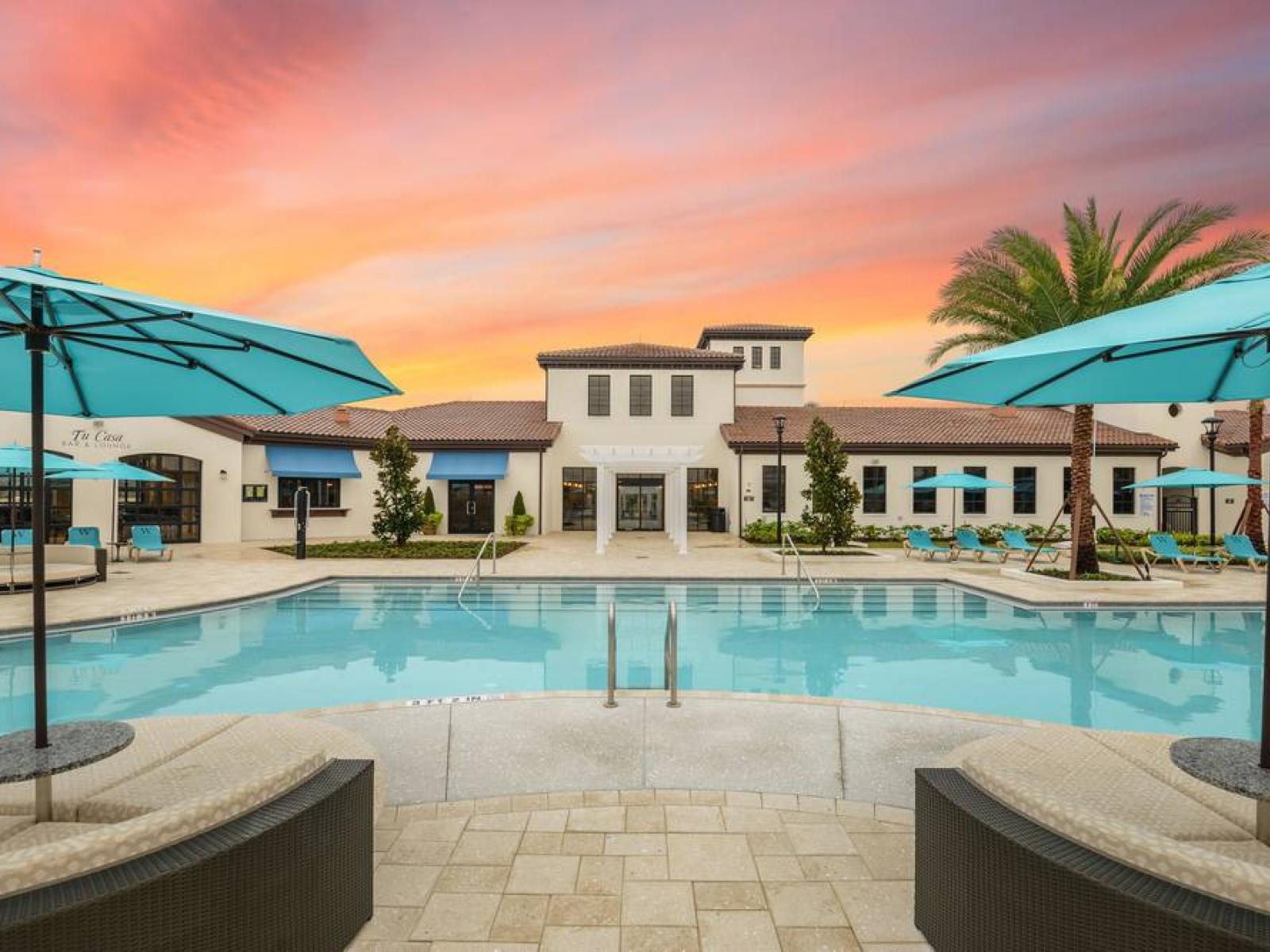 Magnificent Pool Area of the Apartment in Reunion Florida - Relax by the shimmering poolside oasis - Dive into a refreshing poolside escape - Inviting pool area for a perfect getaway - Comfortable sitting arrangements for ultimate relaxation