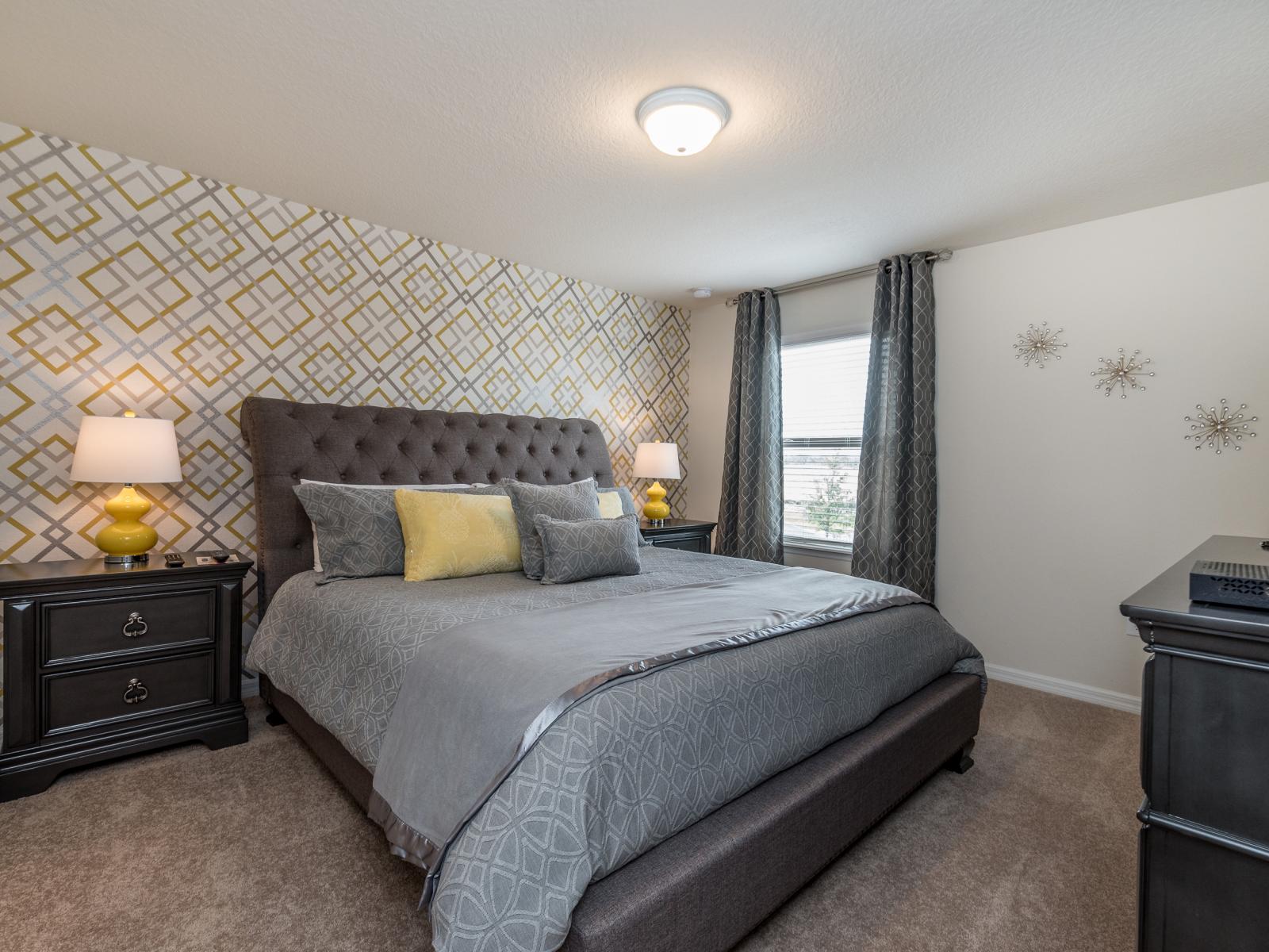 This bedroom, graced with an accent wall, exudes magnificence and character. The interplay of colors and textures creates a captivating atmosphere, turning the space into a regal retreat for moments of pure luxury and comfort.