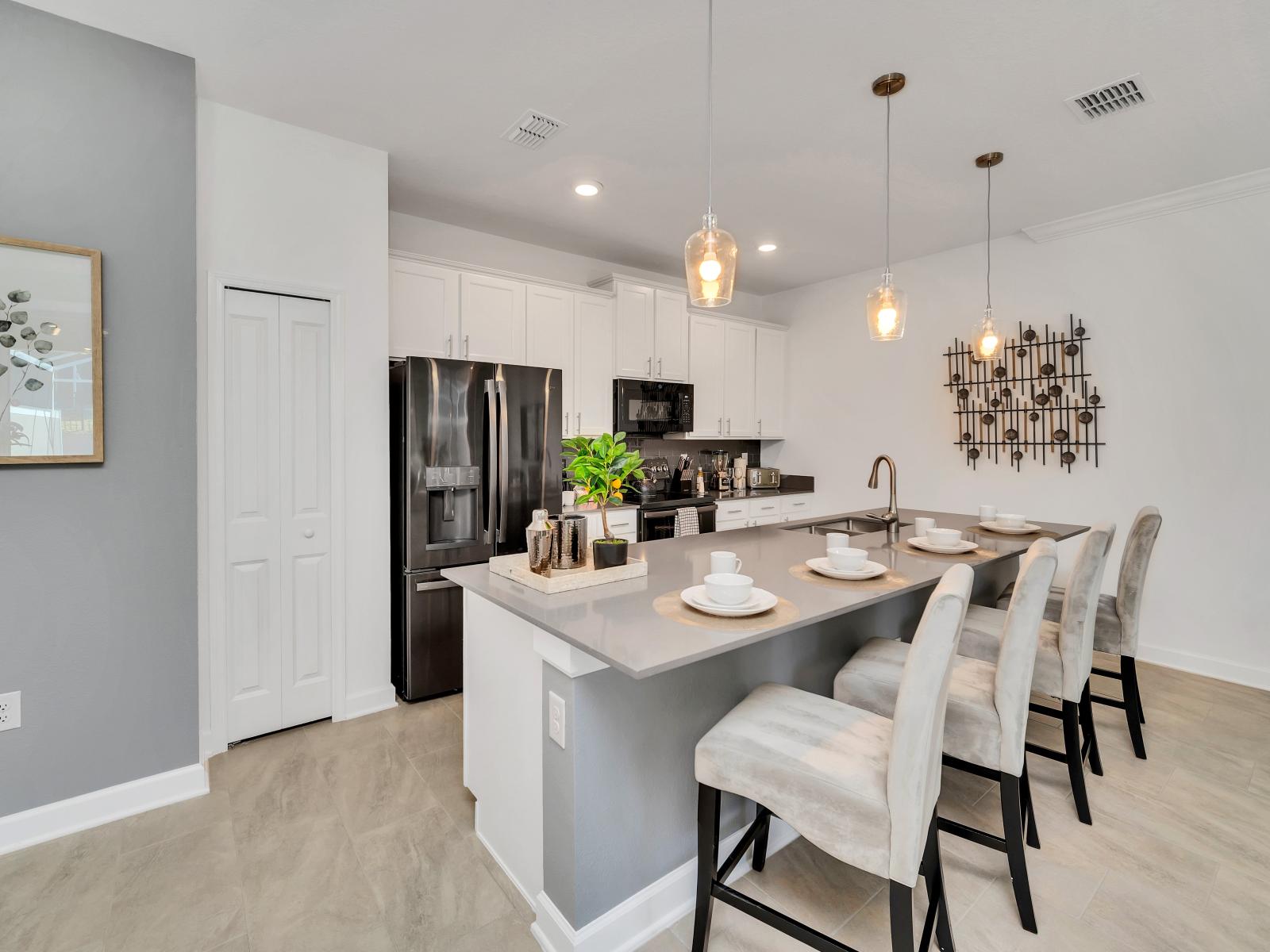 The kitchen area has sleek countertops, state-of-the-art appliances, and ample space for meal preparation, it offers the perfect setting for culinary adventures and memorable dining moments with family and friends.